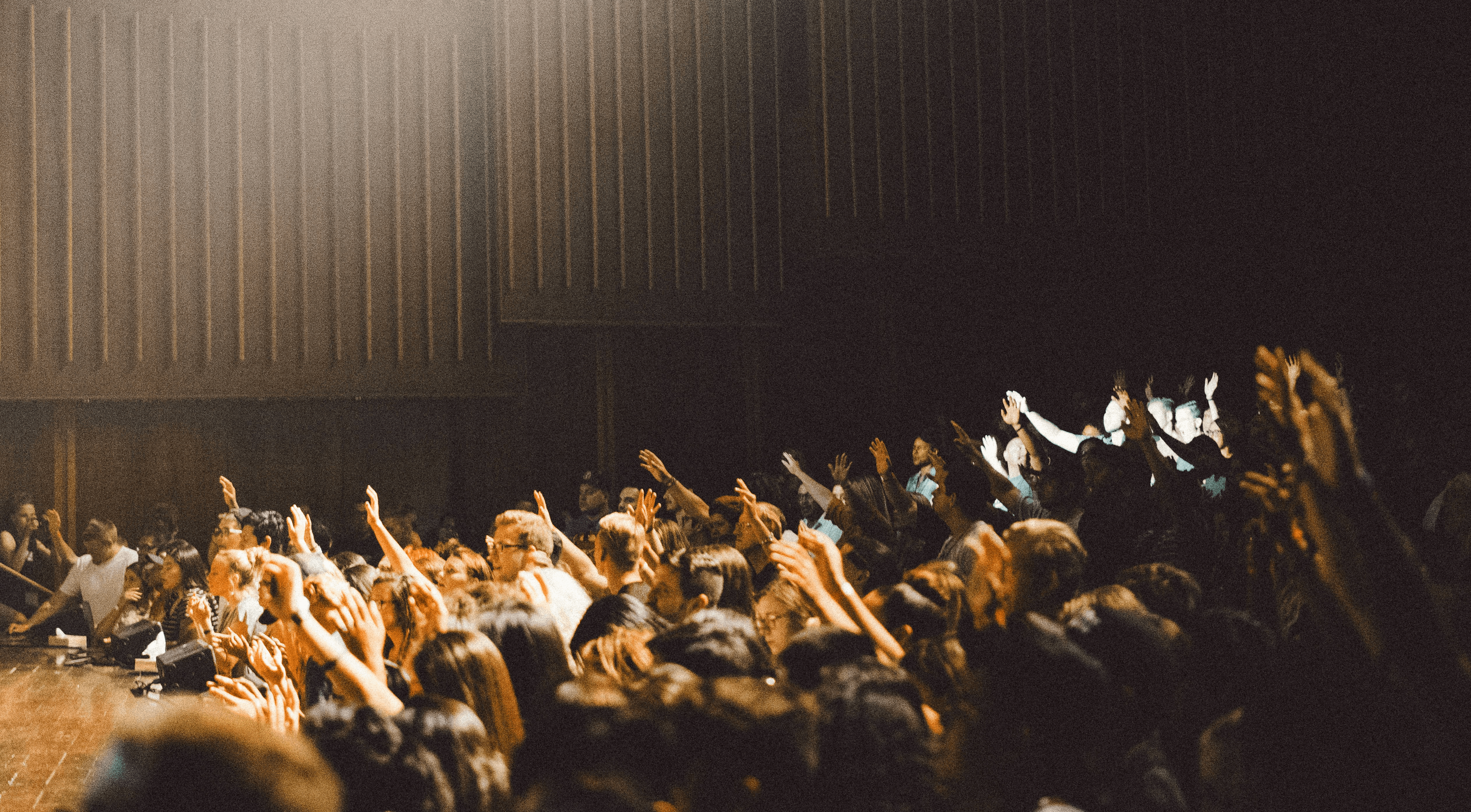 people raising their hands