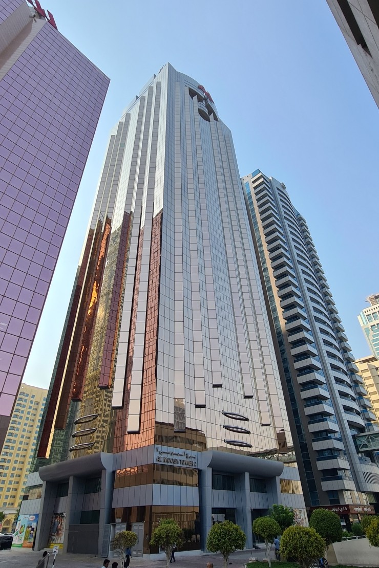 Ground up perspective of the elegant Al Moosa Tower 2 facade. Contact us for exclusive real estate listings.