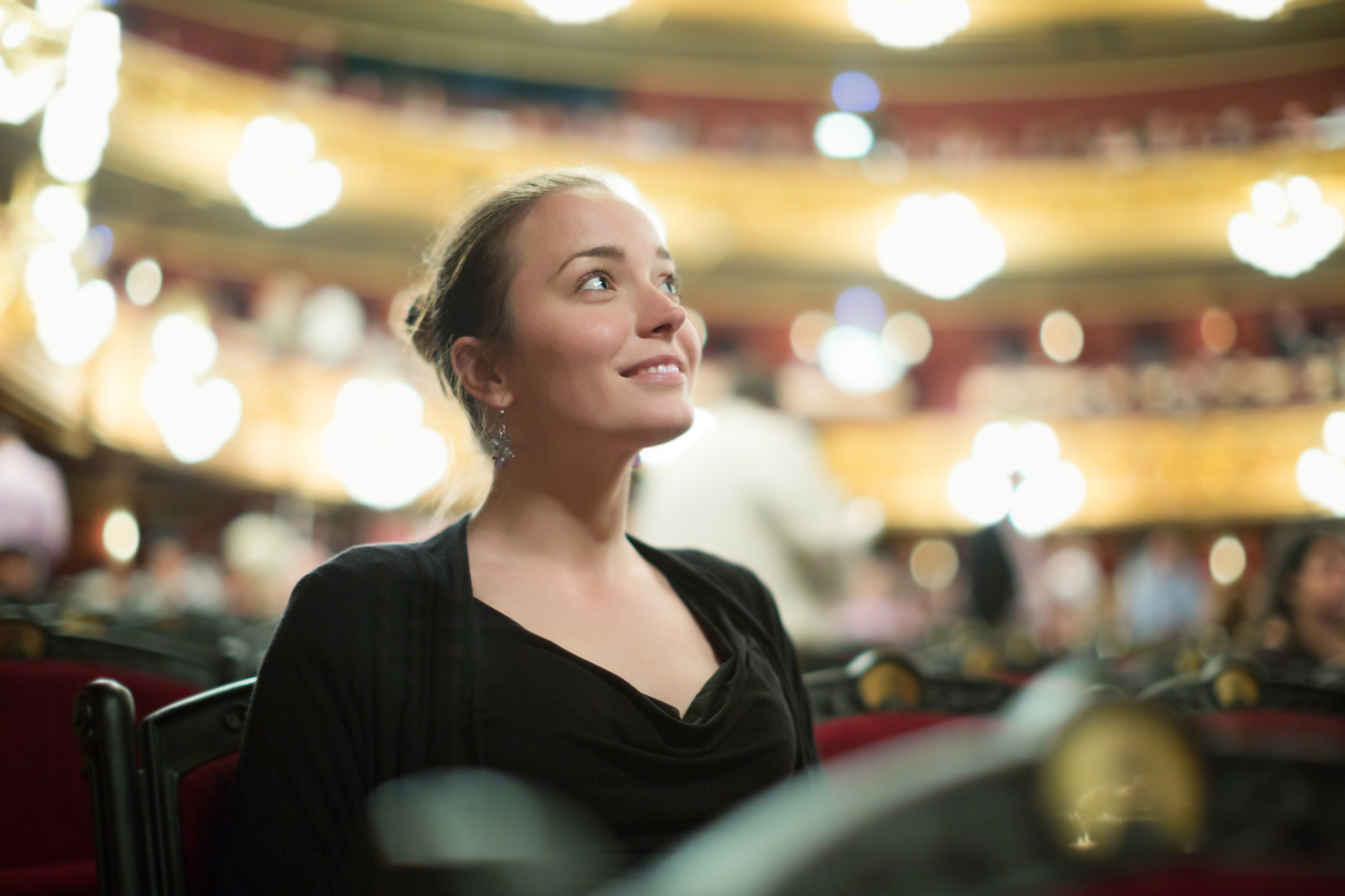 Woman sitting in concert hall