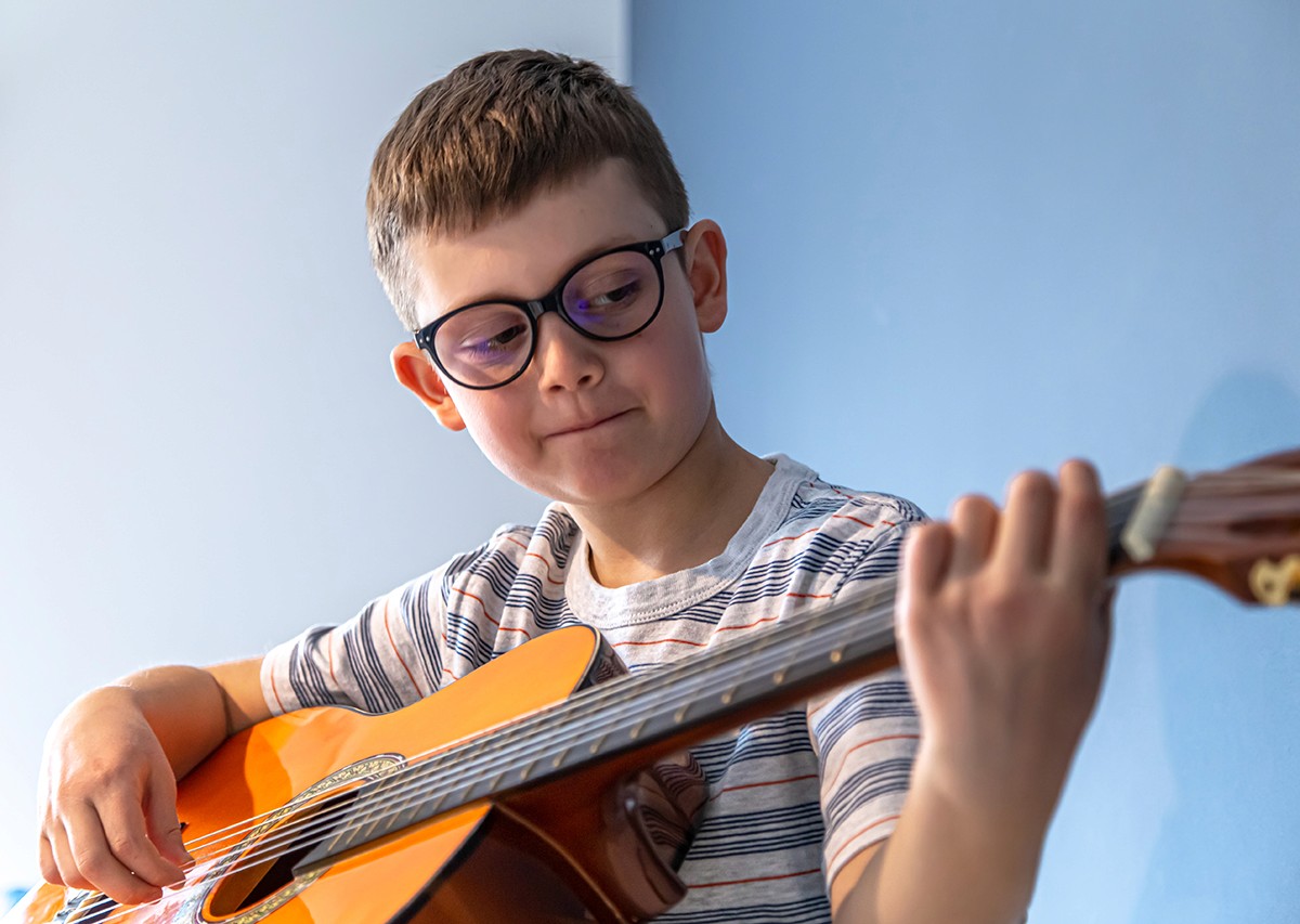 Child guitar player