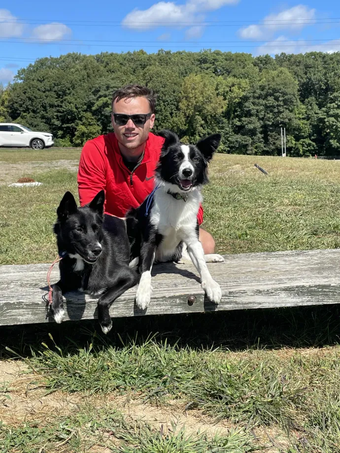 Dog learning to sit and stay on a place.