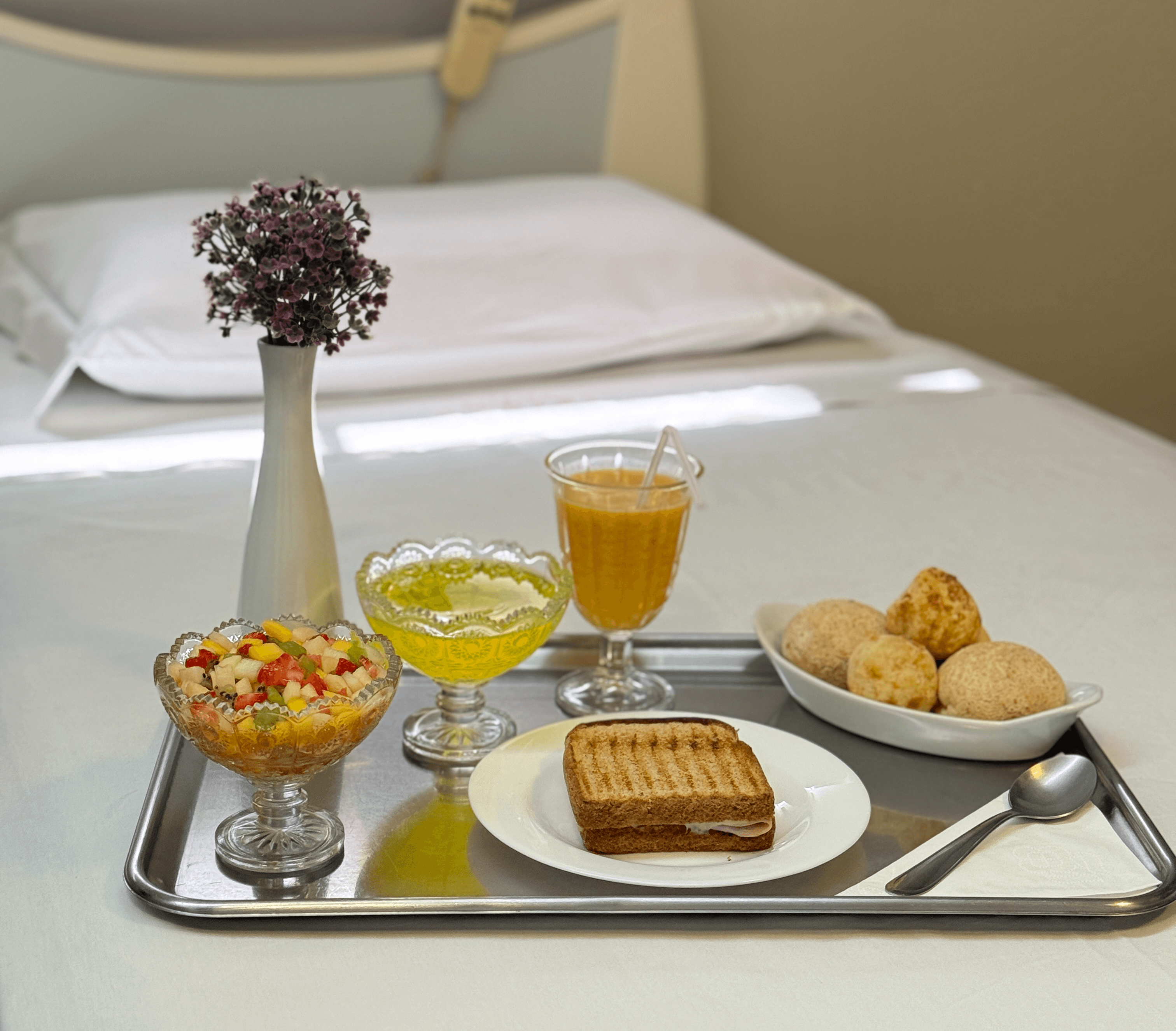 white bed with gray pillow