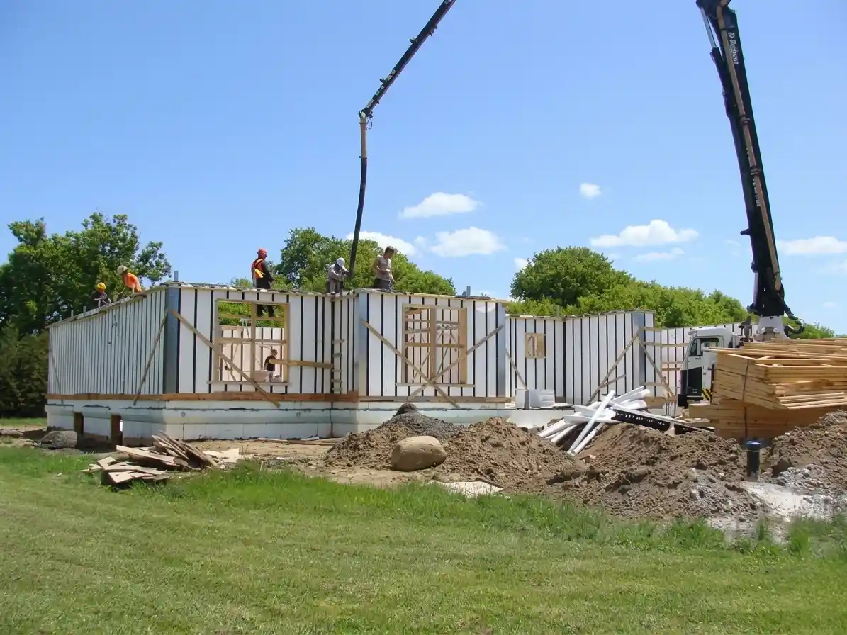 A new home build getting concrete poured into the vertical ICF panel walls