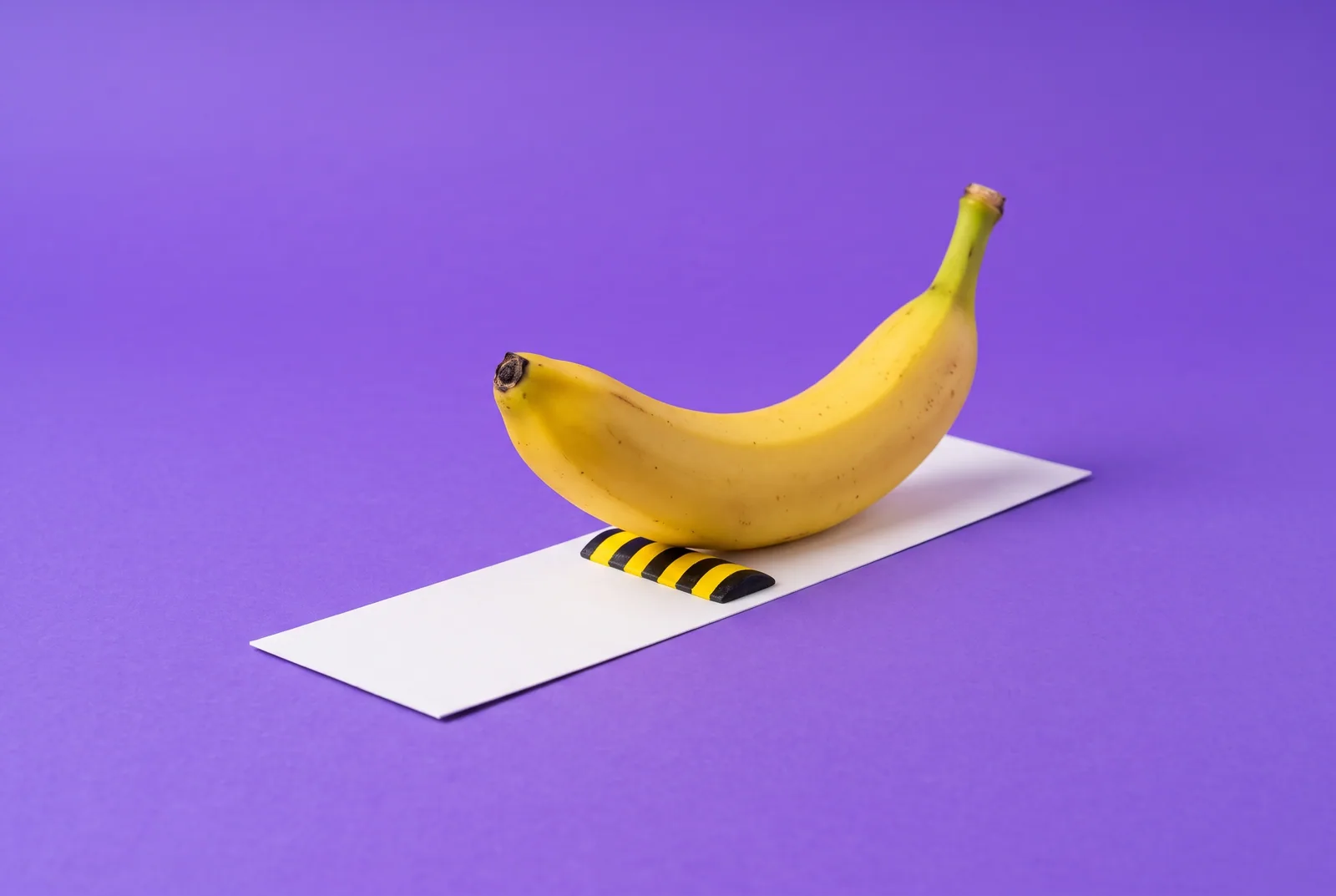 A banana rolling over a tiny striped speed bump, the loopholes a lock SafeSearch setup doesn't close