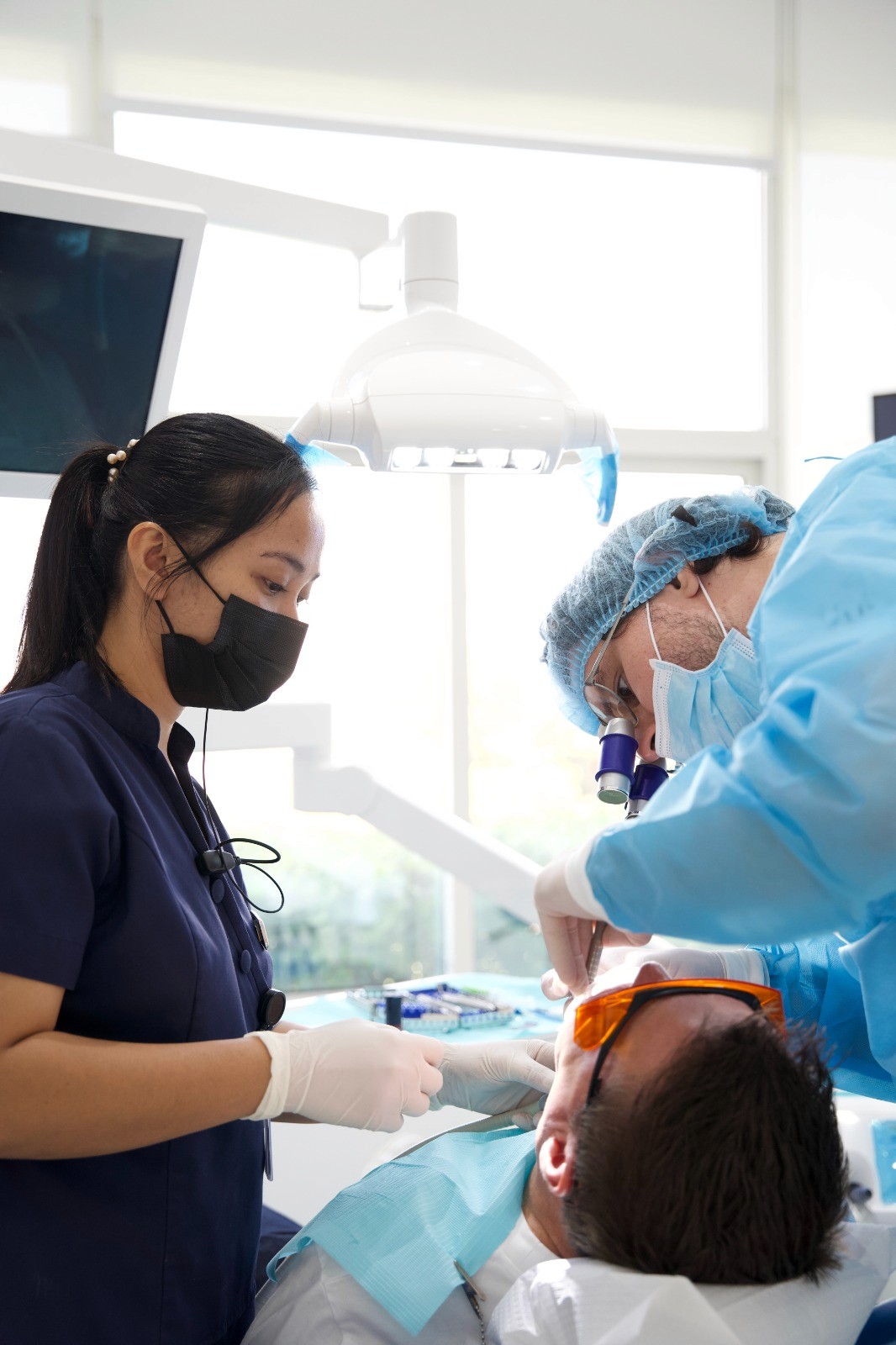 Oral and maxillofacial specialists performing orthognathic surgery in a clinical setting, showcasing world-class surgical care.