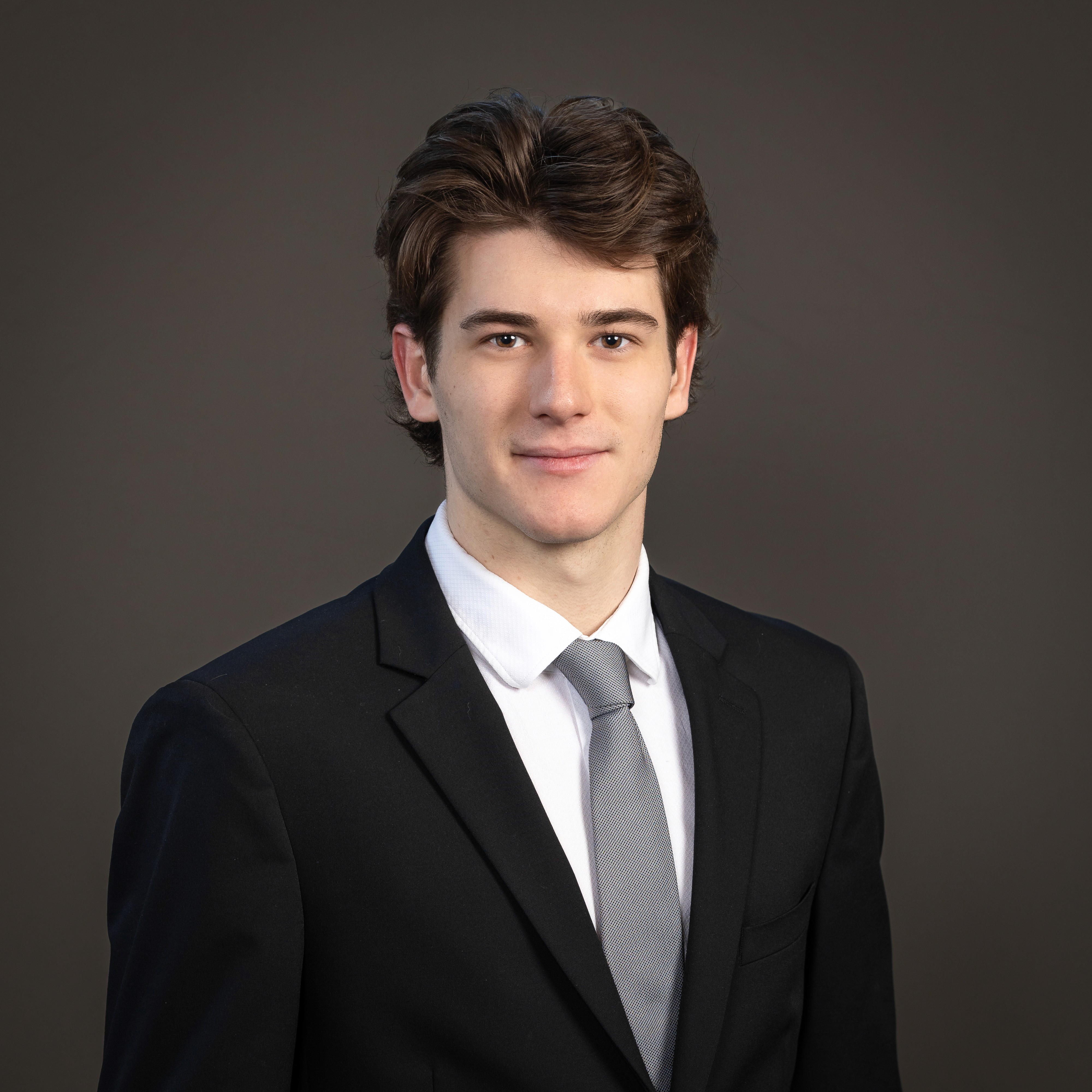 person sitting in a chair in front of a man