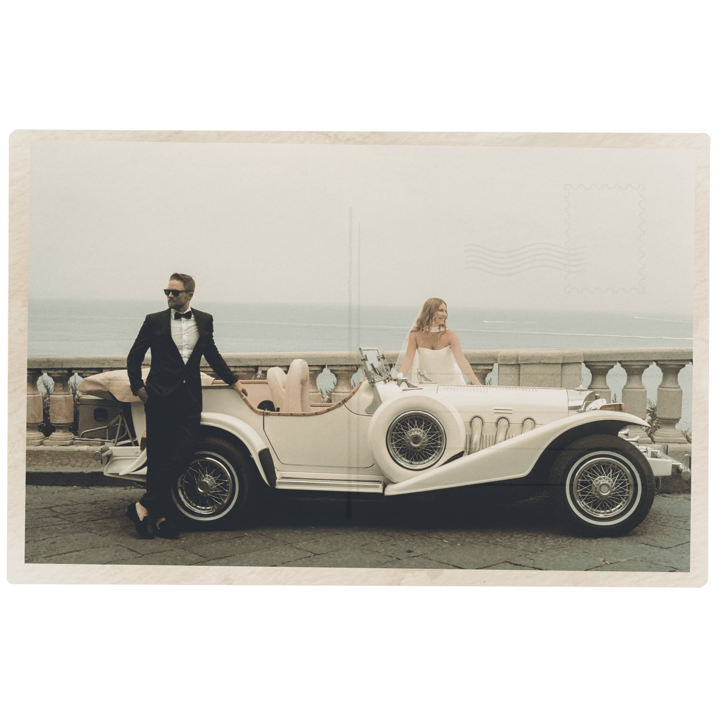 Italy wedding photographer captures couple in front of a vintage car on the Amalfi coast.