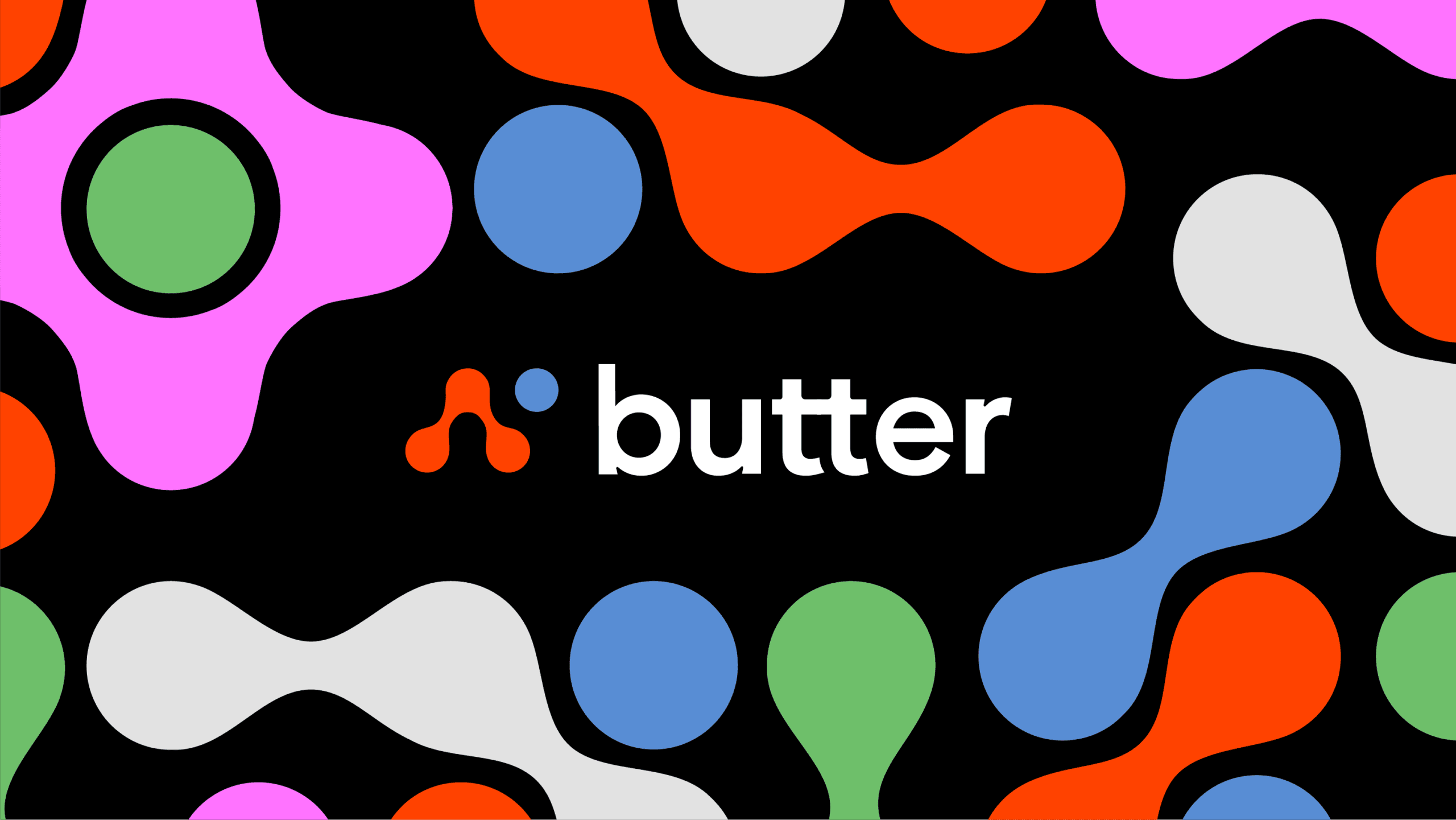 A brick building displays three large billboards. The leftmost billboard promotes learning guitar from someone other than Dan Smith, the center billboard features a blonde girl playing guitar, and the rightmost billboard showcases the word "butter" in white text against a black background with colorful abstract shapes. Two cars are parked on the street in front of the billboards.