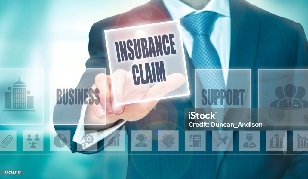 A picture of Businessman reviewing insurance claim issues on digital screen.