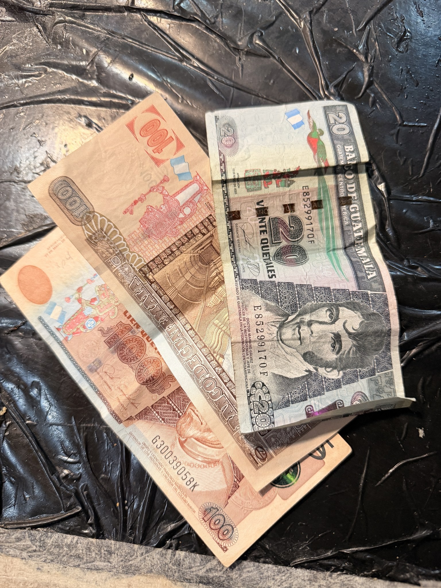 Guatemalan quetzal banknotes, the cash the border crossings run on.