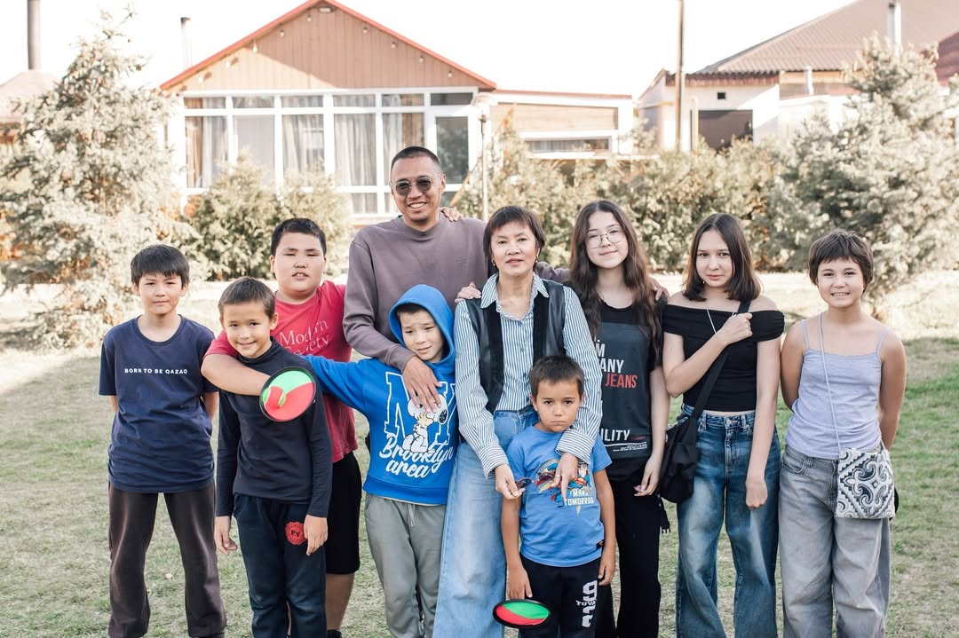 two people looking at a tablet and smiling