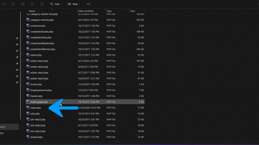 GIF showing a file directory where a blue arrow points to the ‘index.php’ file to be opened for manual installation.