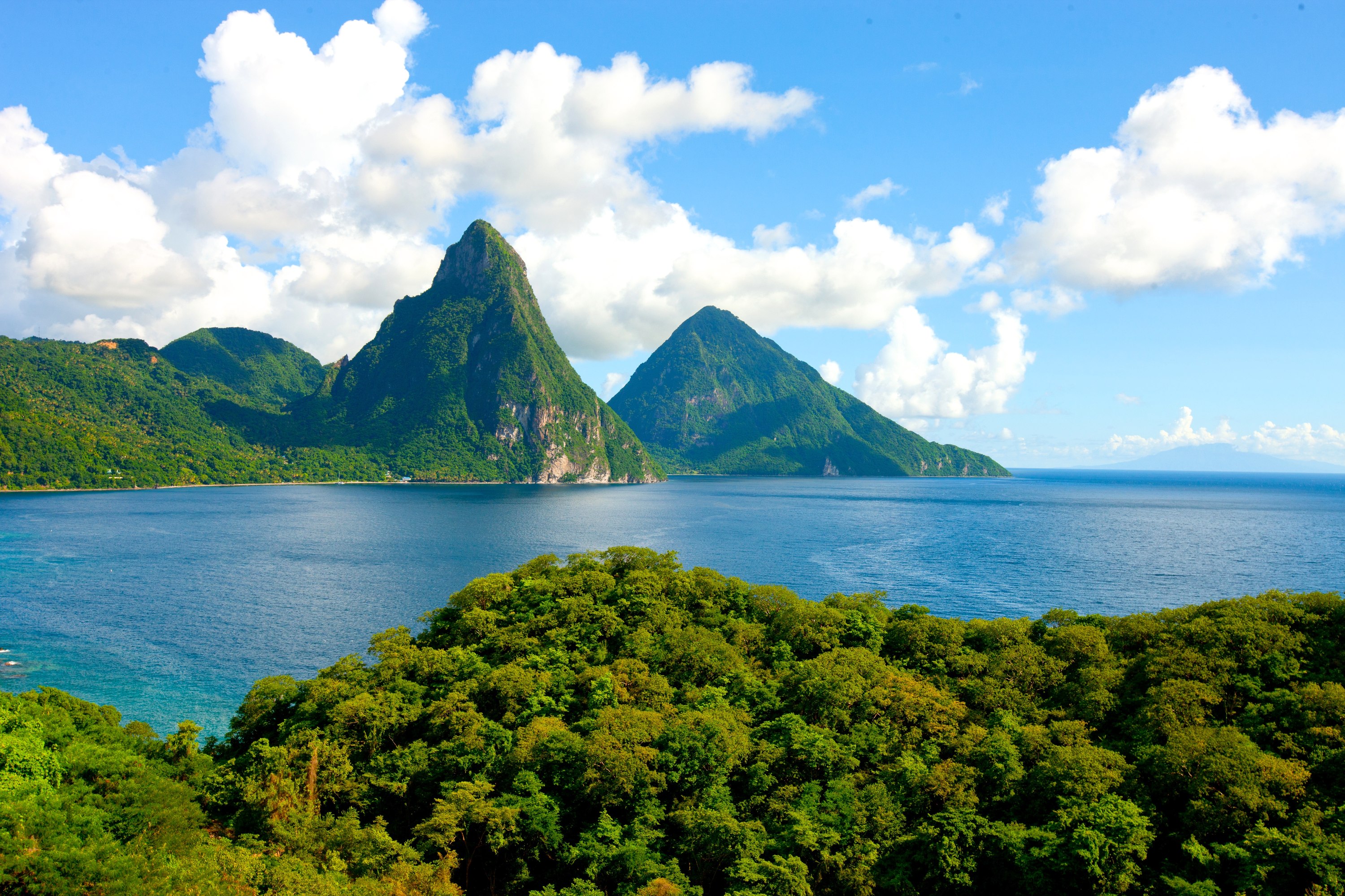The Pitons rising above the rainforest and Caribbean Sea, seen from Jade Mountain, Saint Lucia