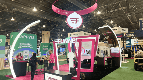 20x20 trade show booth with branded arch structure, demo area, reception counter, and open visitor flow