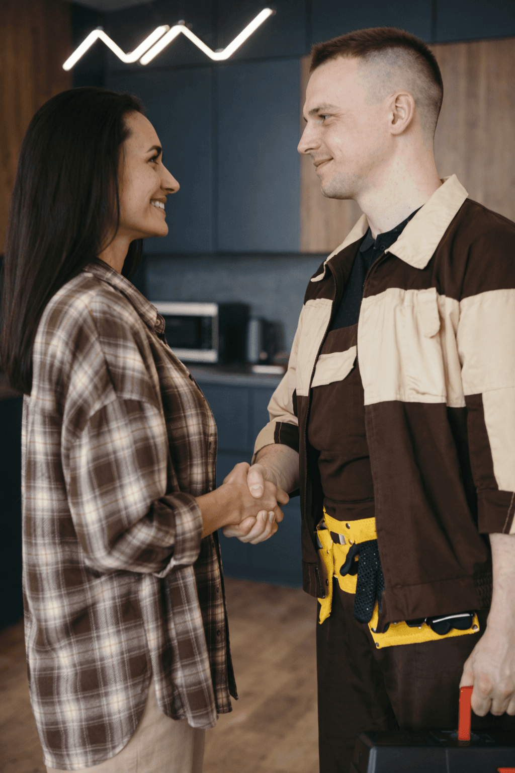 Image of our contractor and a client shaking hands