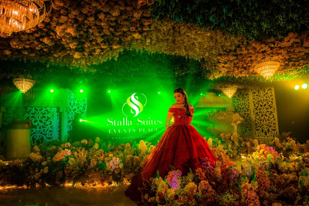 Debutante in red under emerald light at Pandora Hall, Stalla Suites Events Place