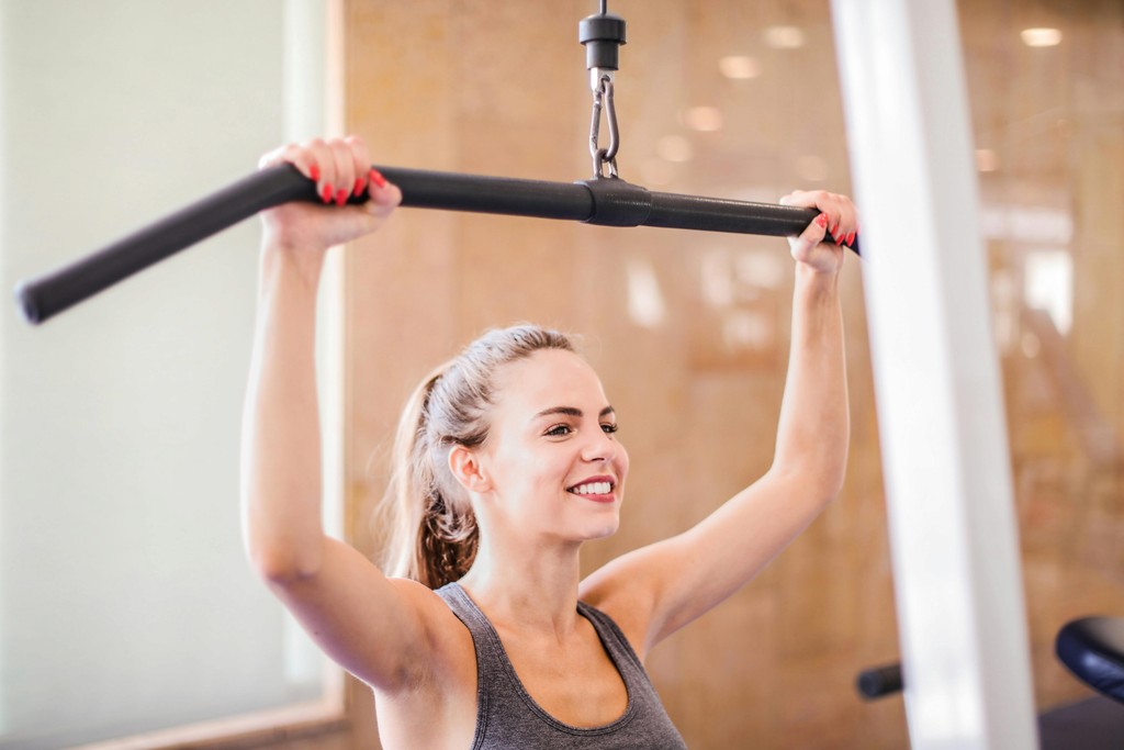 A Picture of Lady Performing a Lat Pulldown