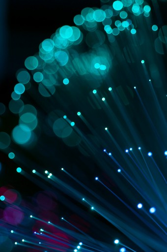 Background featuring glowing teal fibers.