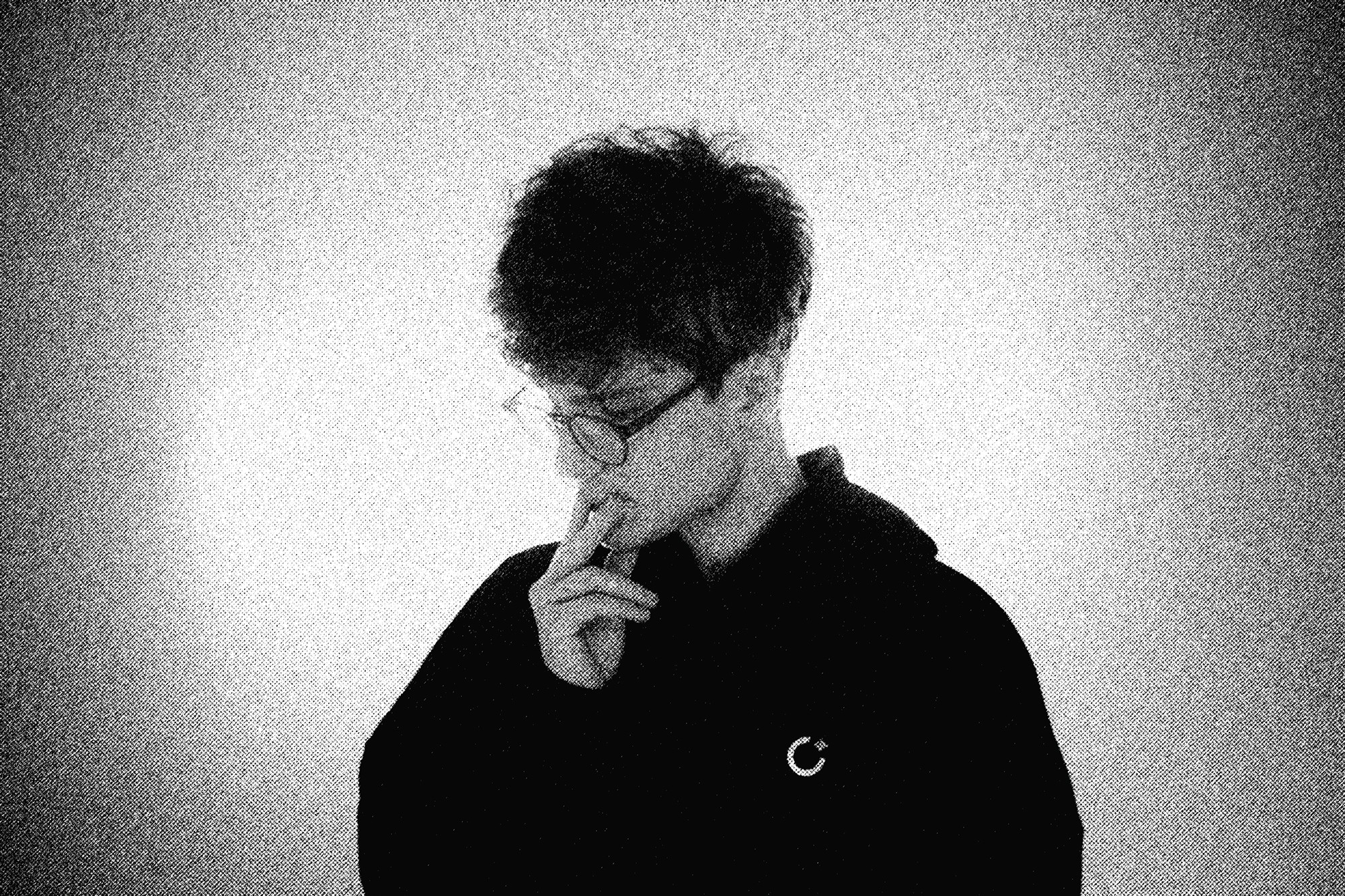 Black and white photo of man posing on camera