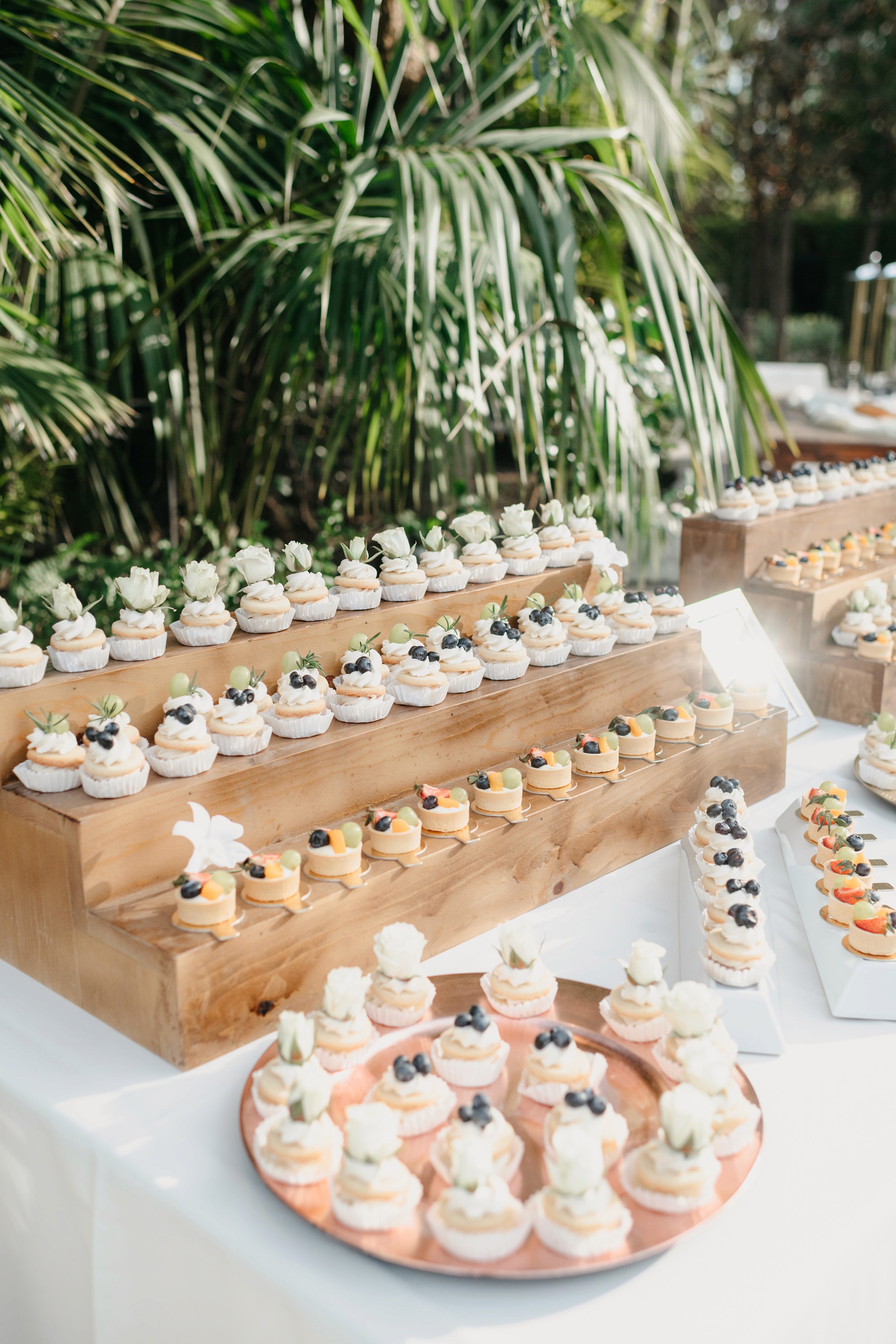 Flat lay wedding details with bouquet, rings, and sparkling bridal heels