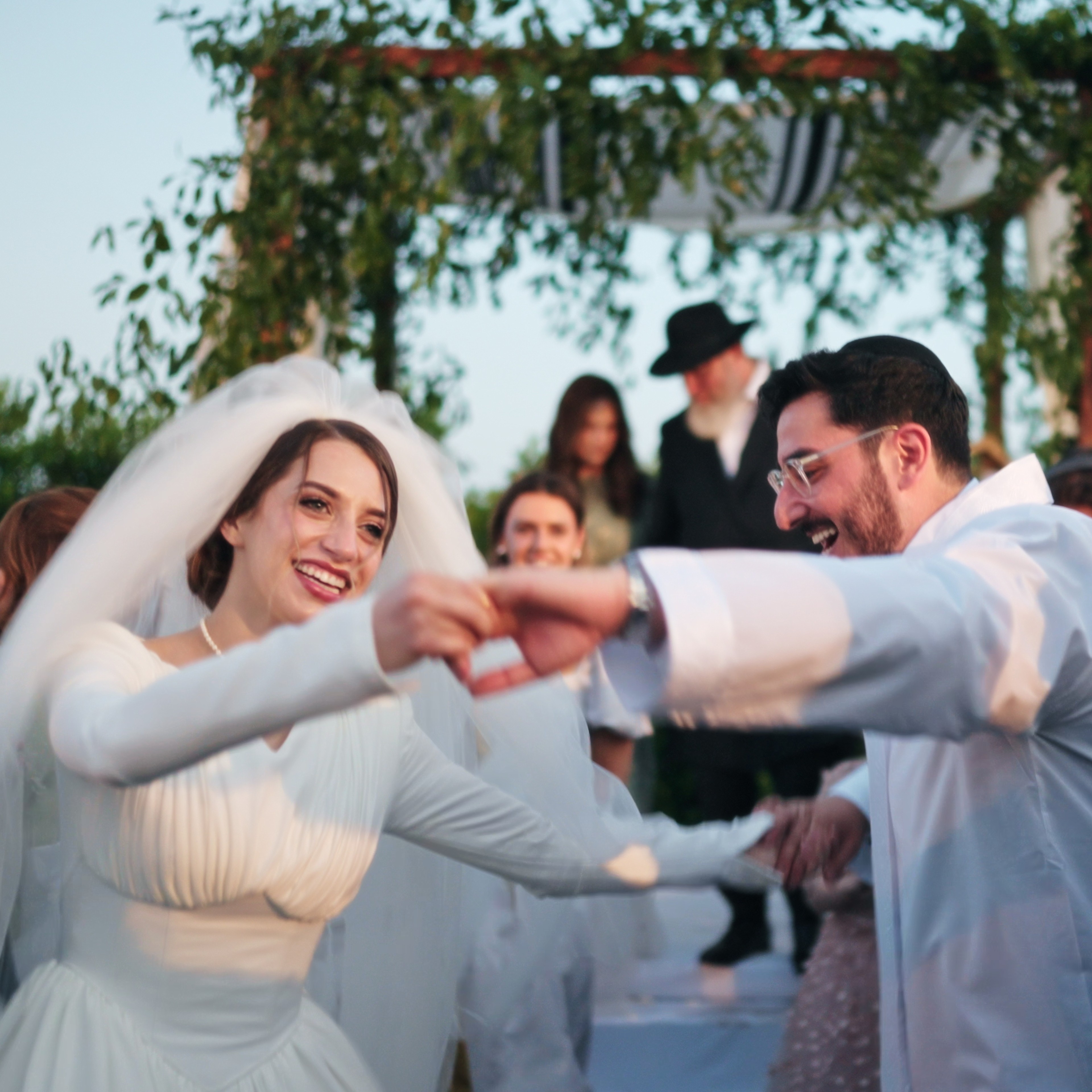 man holding gold ring on woman's finger