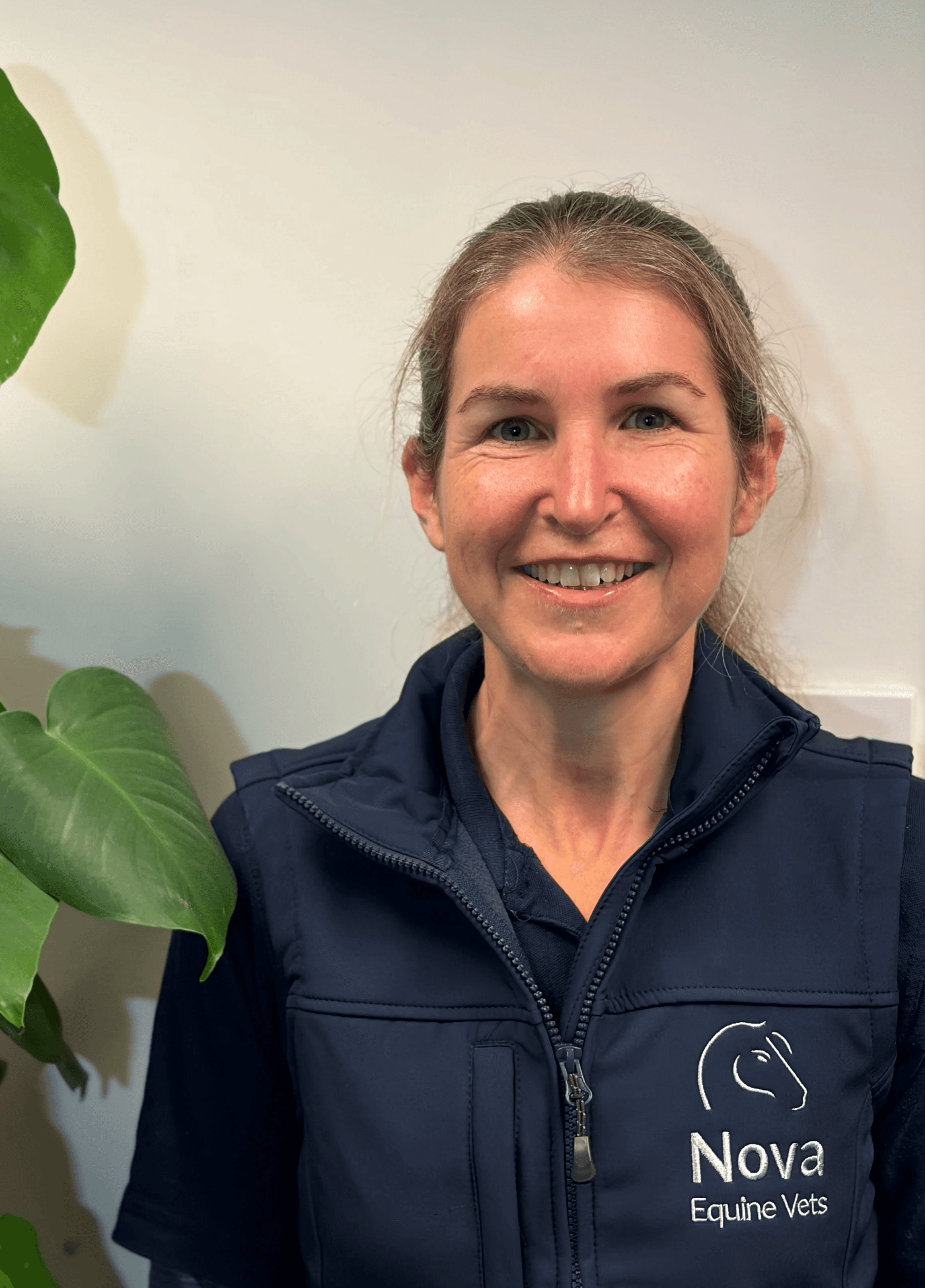 woman in red cardigan smiling