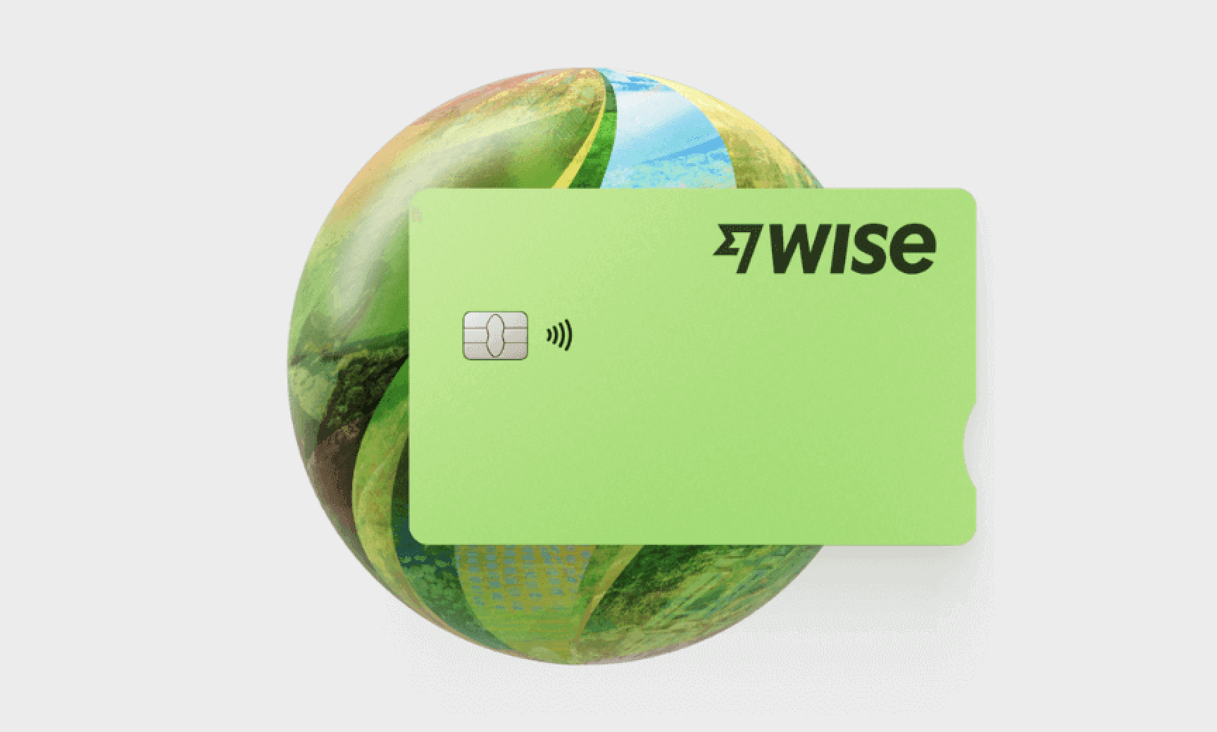 A green Wise multi-currency card displayed on a globe design, emphasizing global travel and spending.