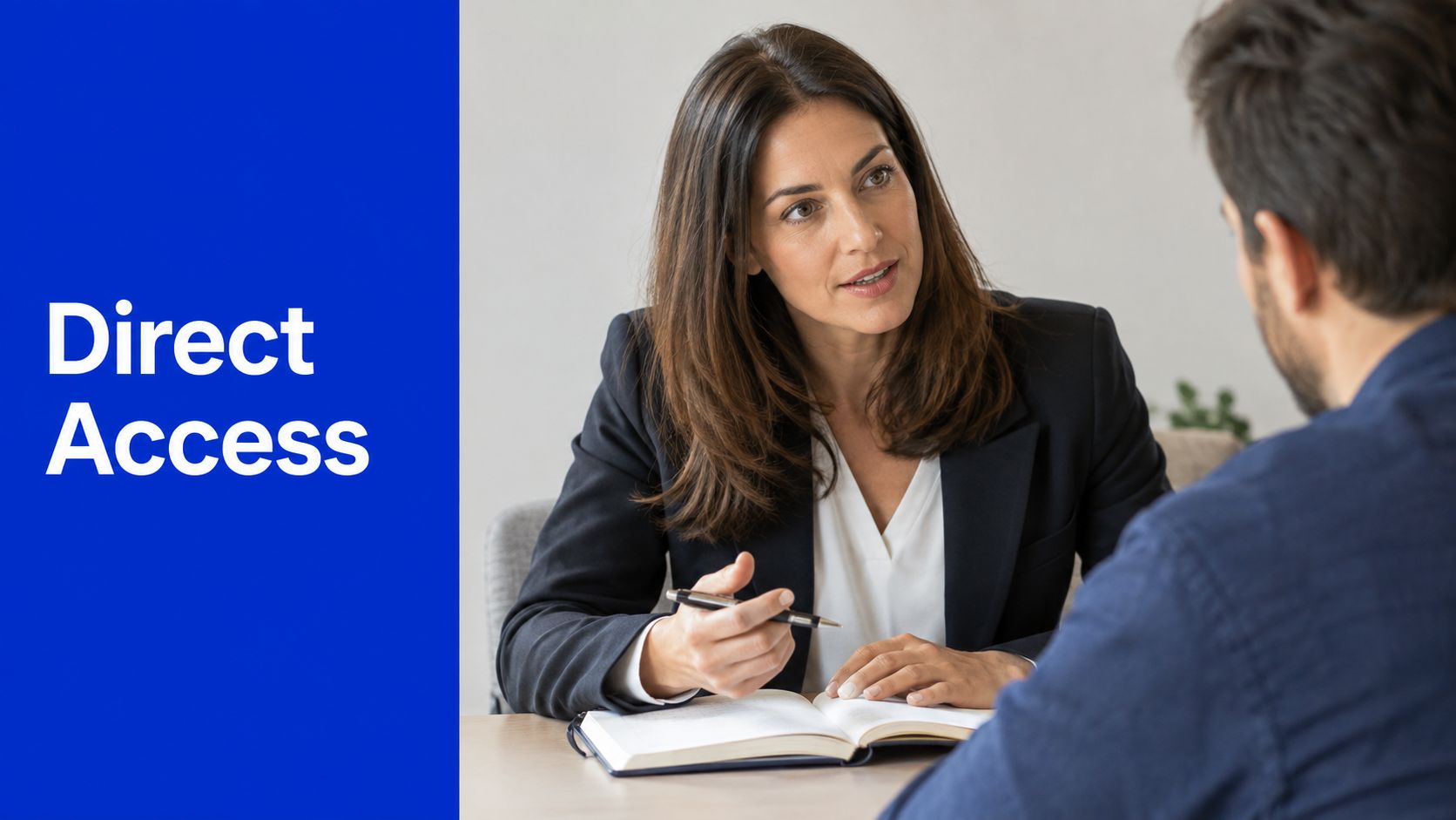 A professional female attorney having a consultation with a male client while reviewing a legal book.