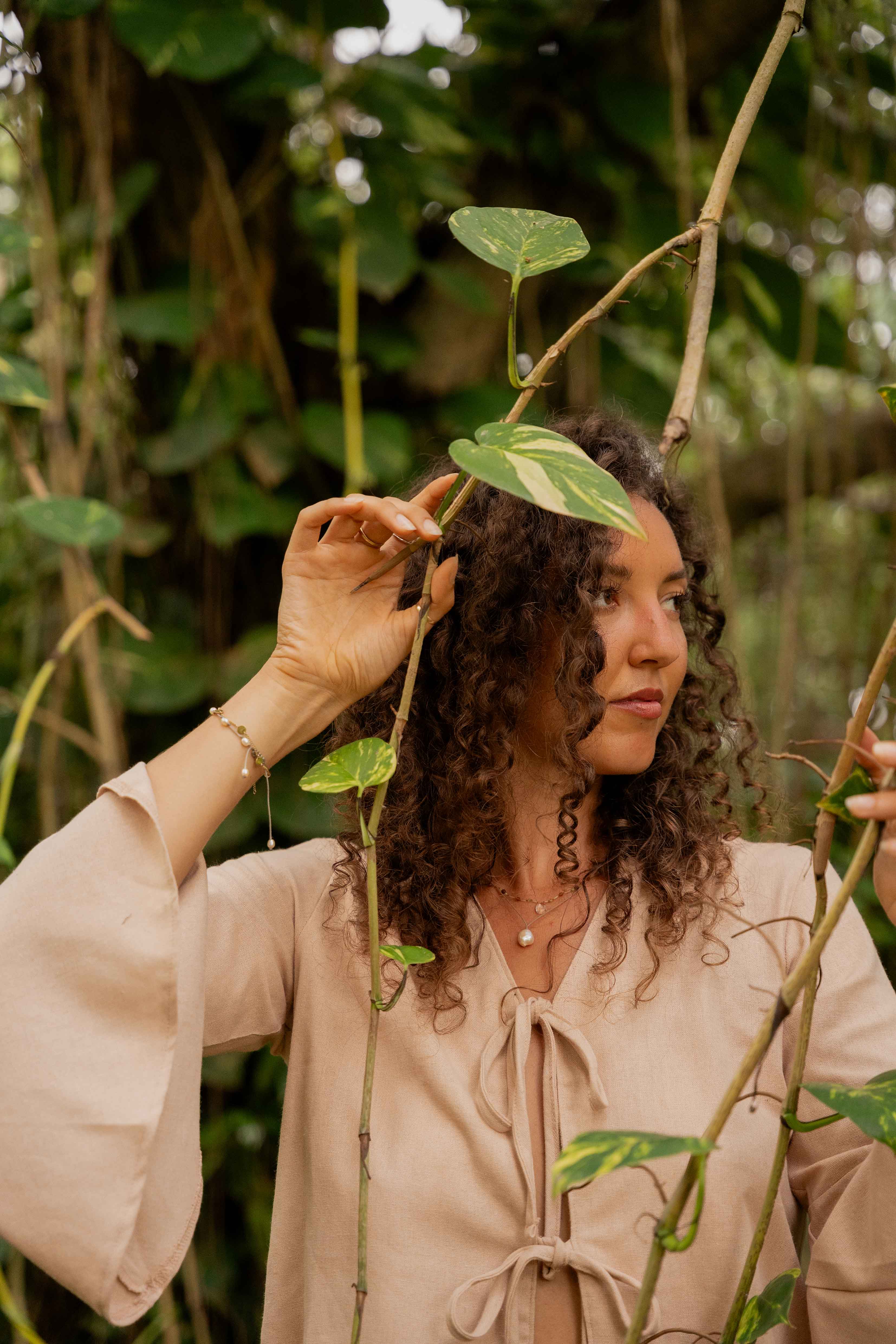 Girl looking away through trees