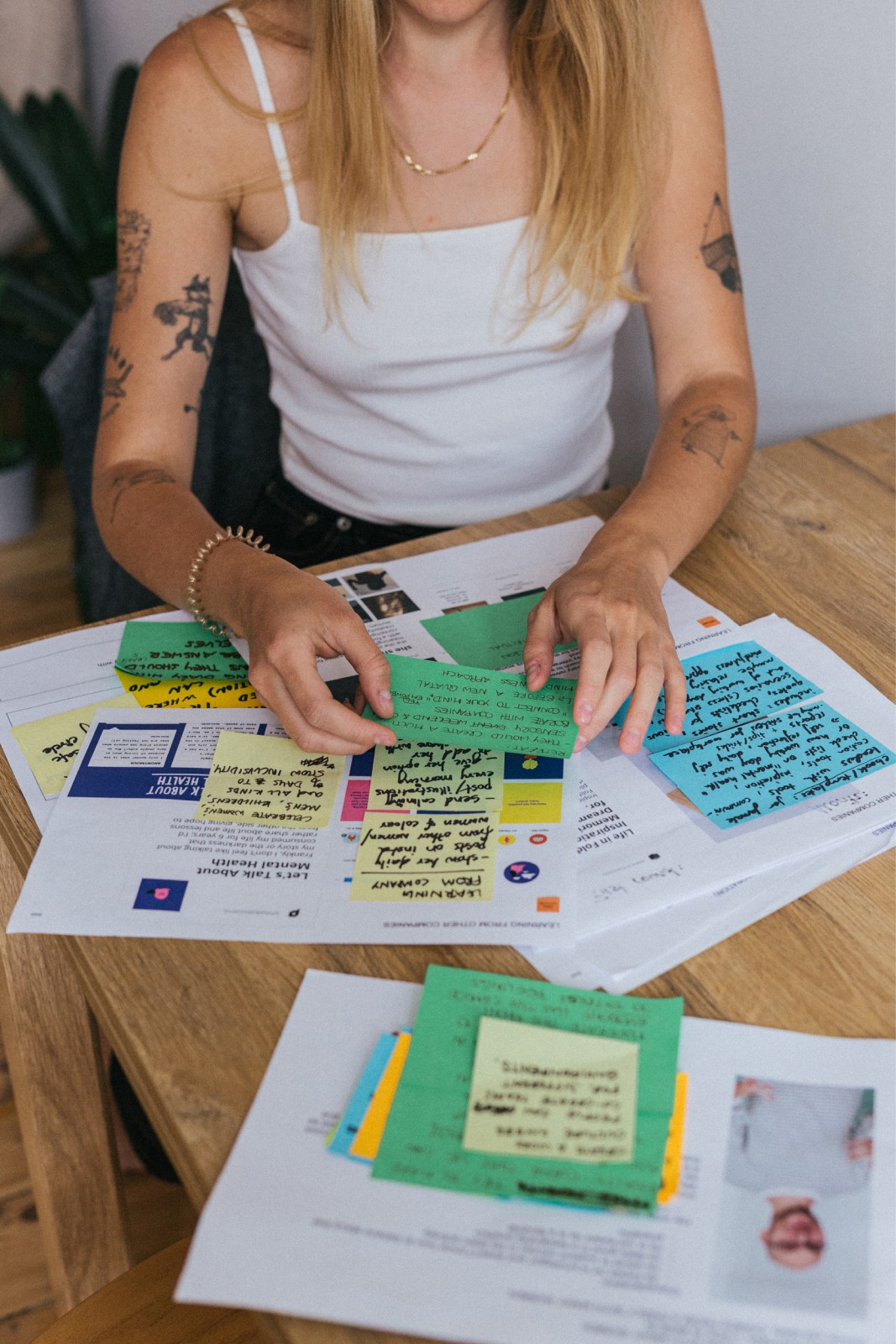 Aga’s hands writing notes during research.