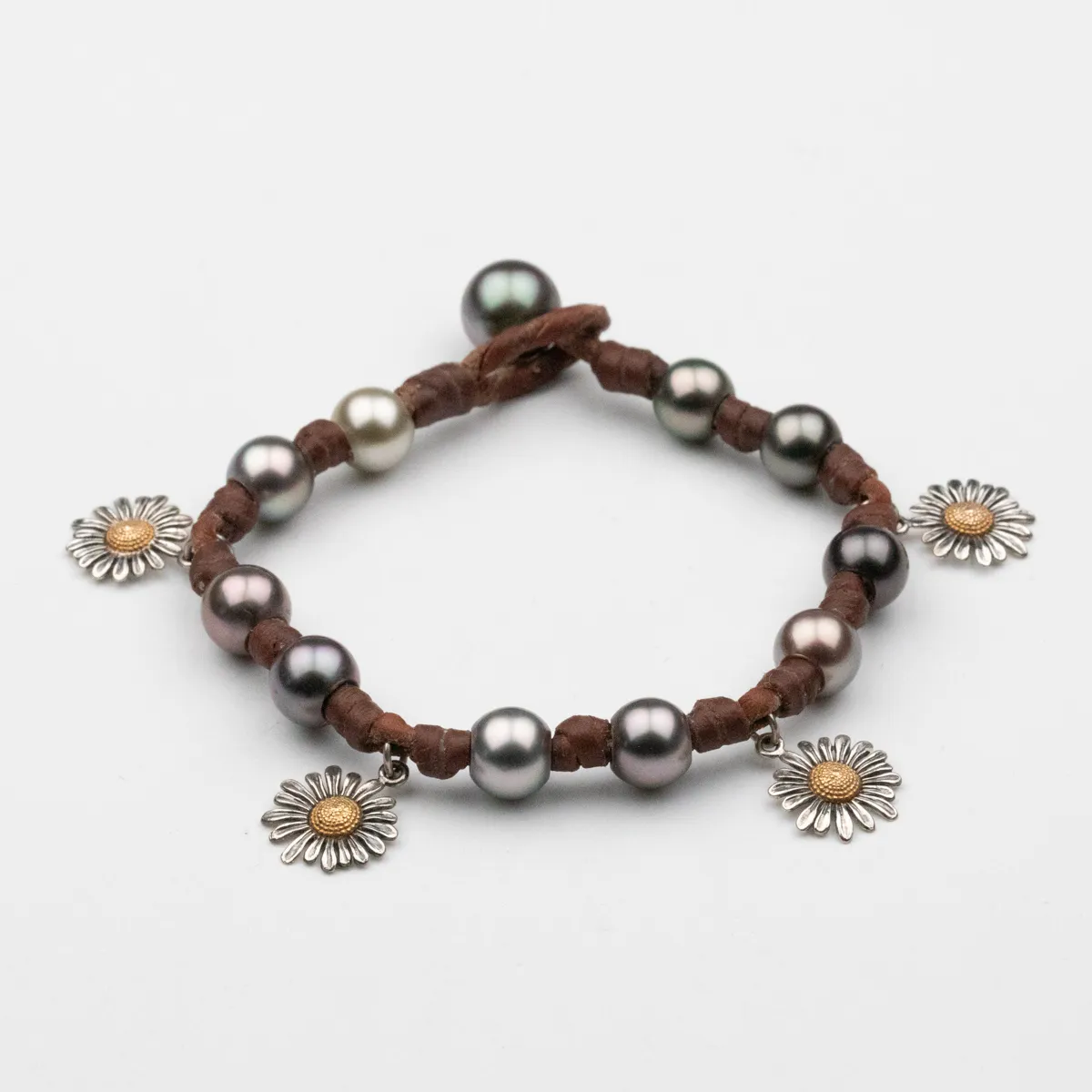 Silver flower charms and Tahitian Pearls on brown leather cord bracelet with loop closure — Manos de Oro Saint Barth