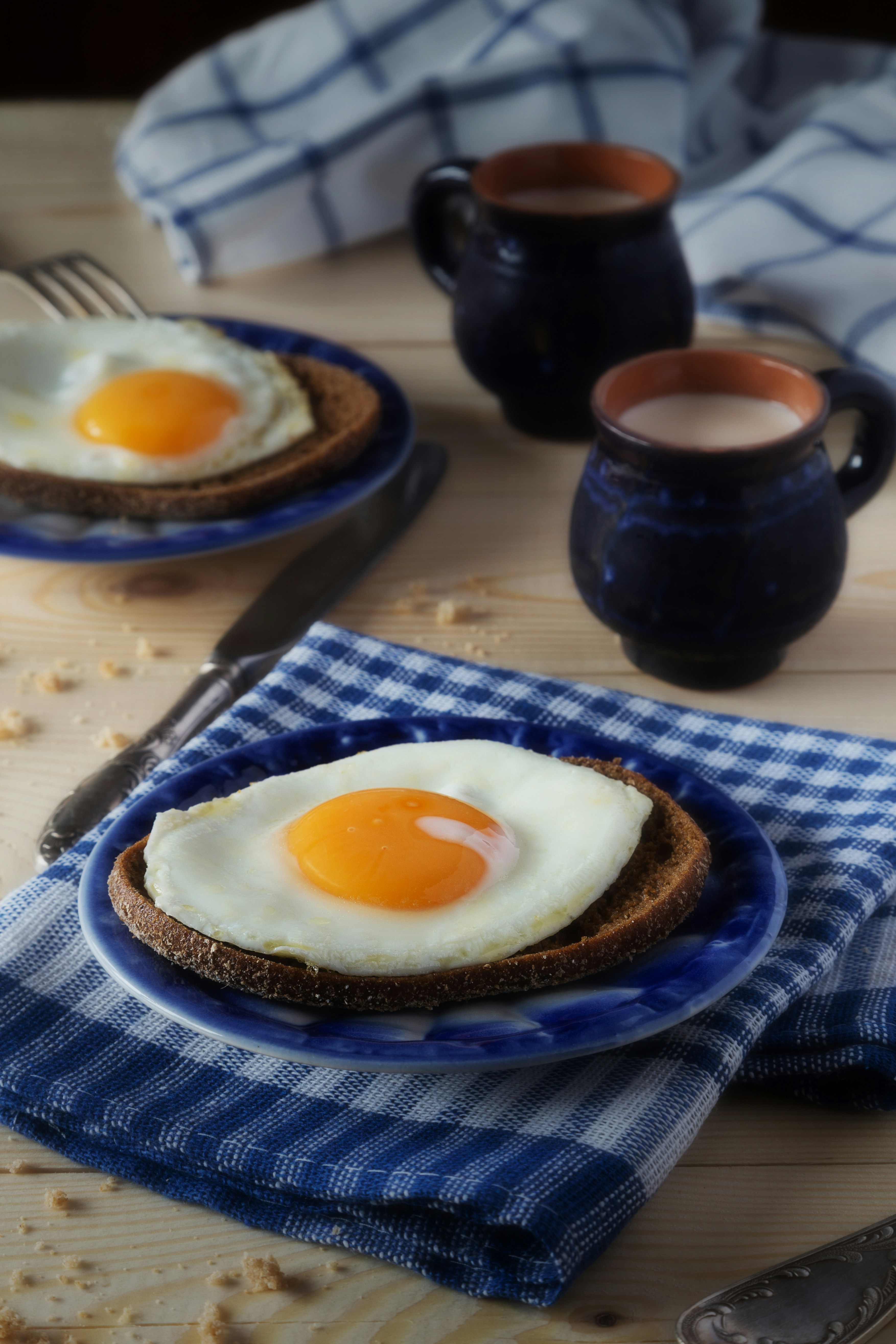 A couple of plates of food on a table