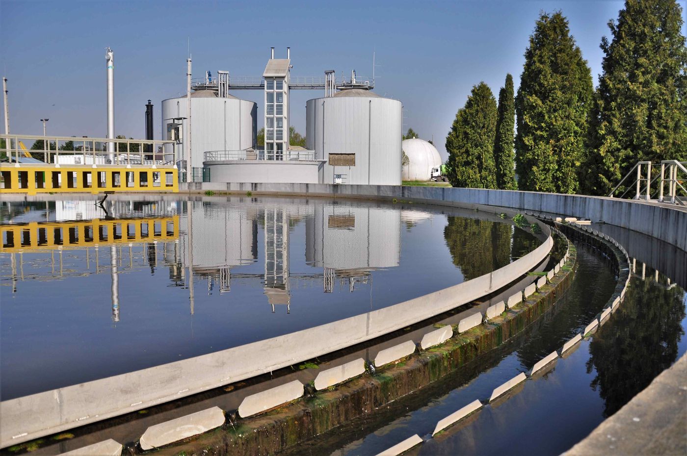 Secondary clarifier reflecting the METHANATOR digesters at the Zalaegerszeg wastewater treatment plant, Hungary