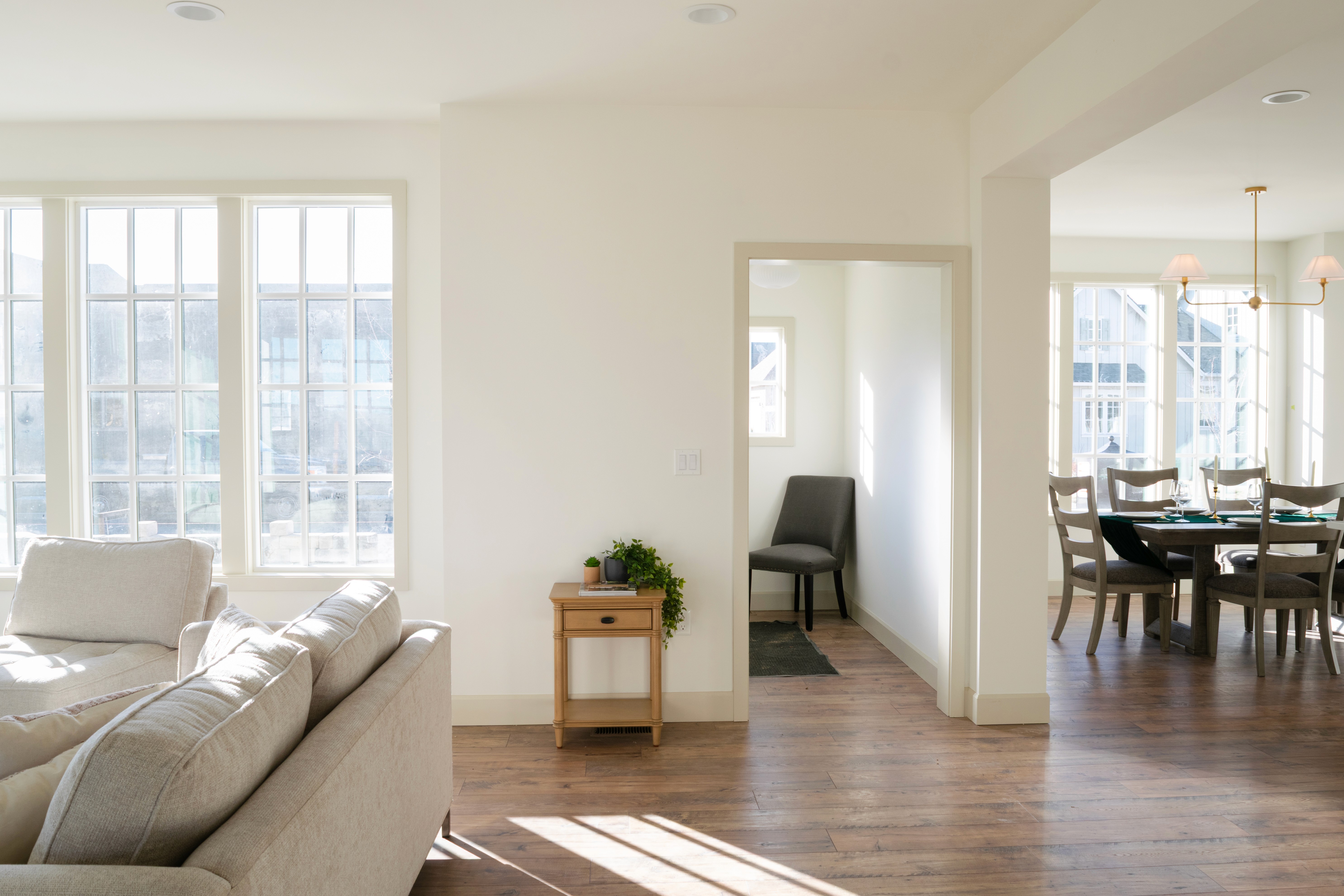 View of entryway opening up to living room on the left and dining room on the right.