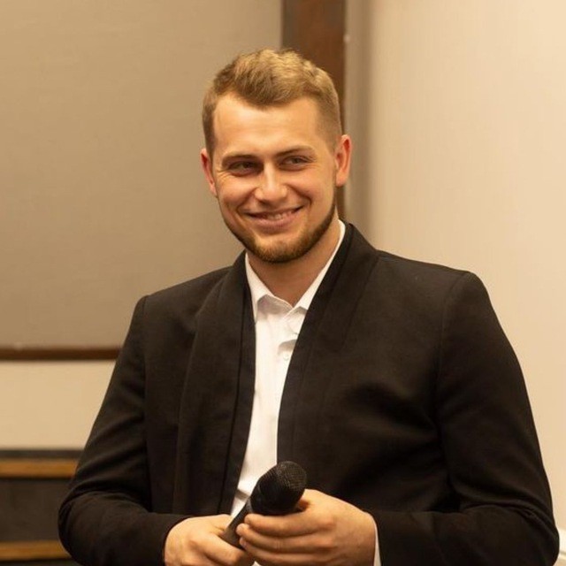 a portrait of a man with a soft smile