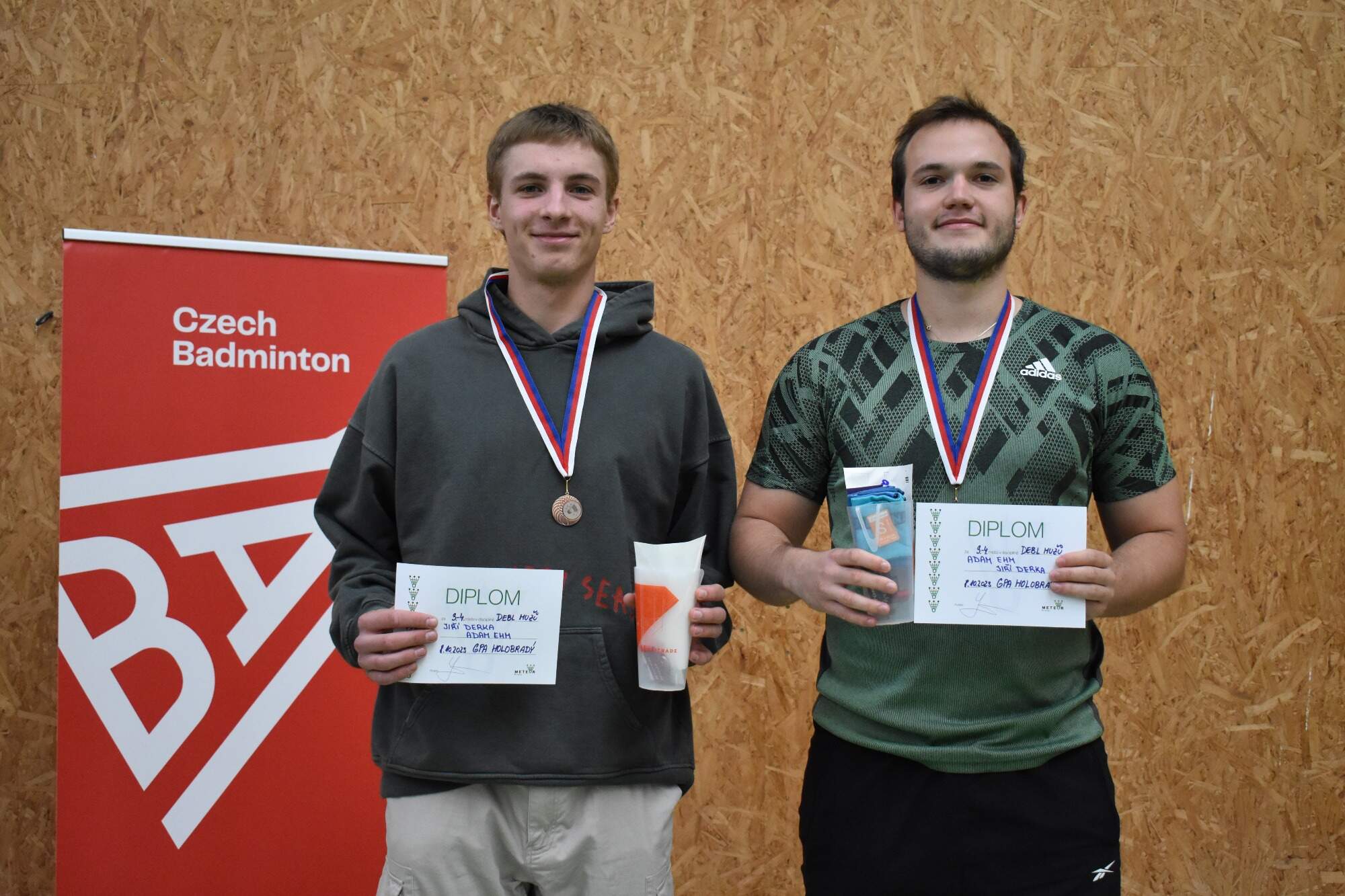 a japanese style building with a japanese roof and trees around it