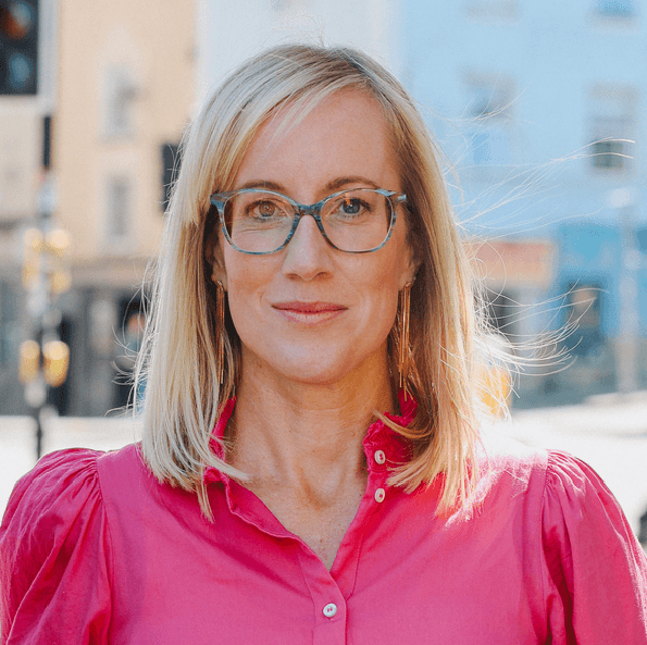A person wearing glasses while looking at the camera.