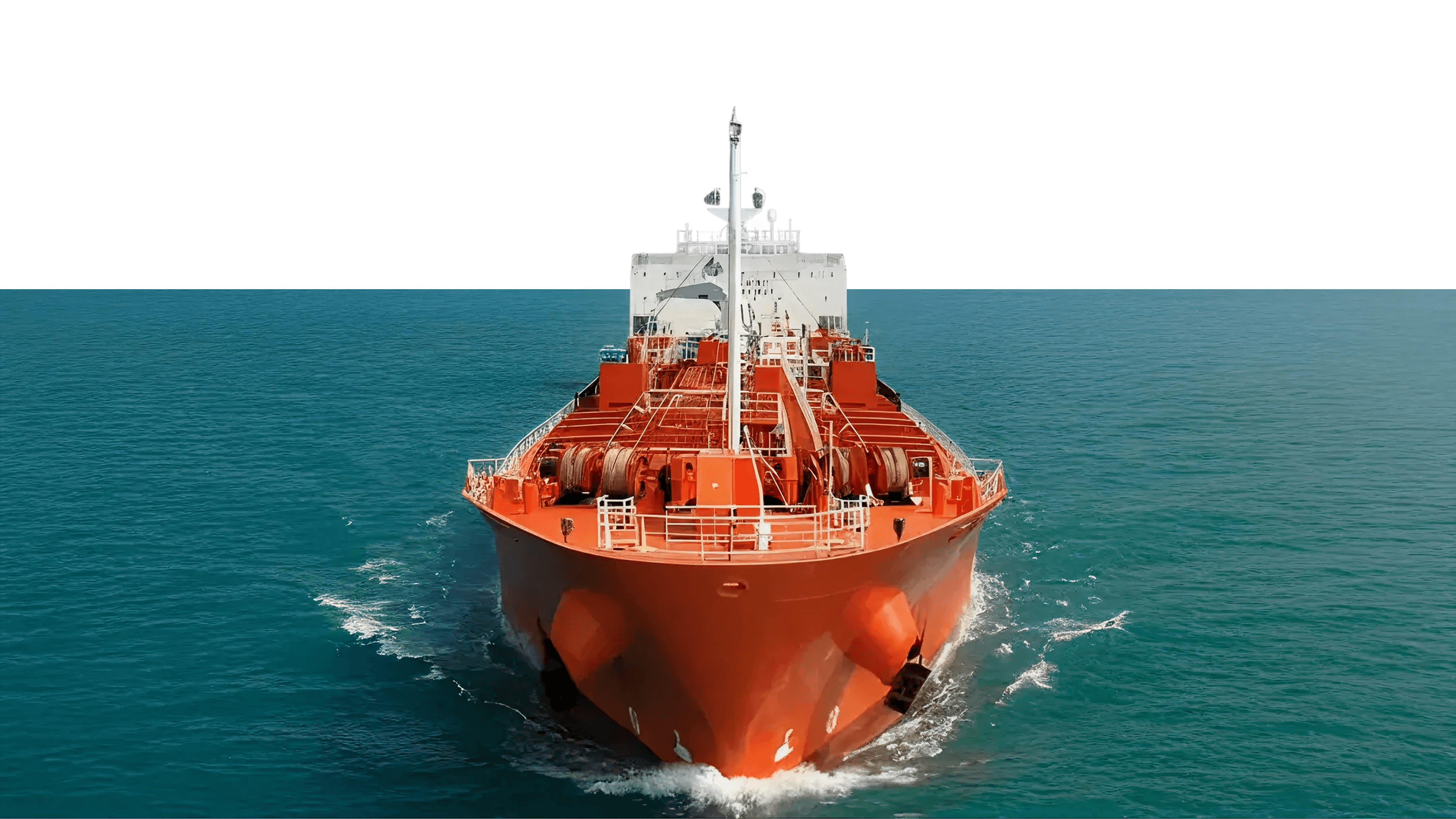 red and black ship on sea under blue sky during daytime