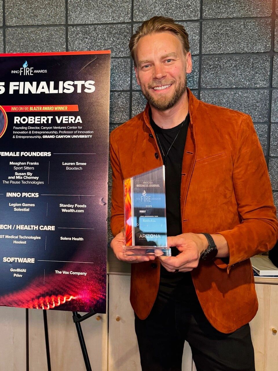 a black and white living room with a large tv