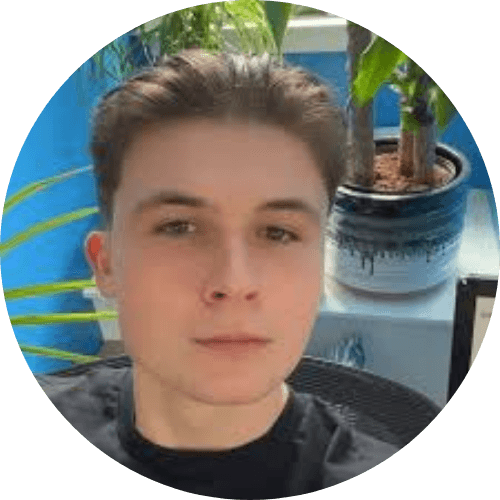 a man with a beard wearing a black hoodie