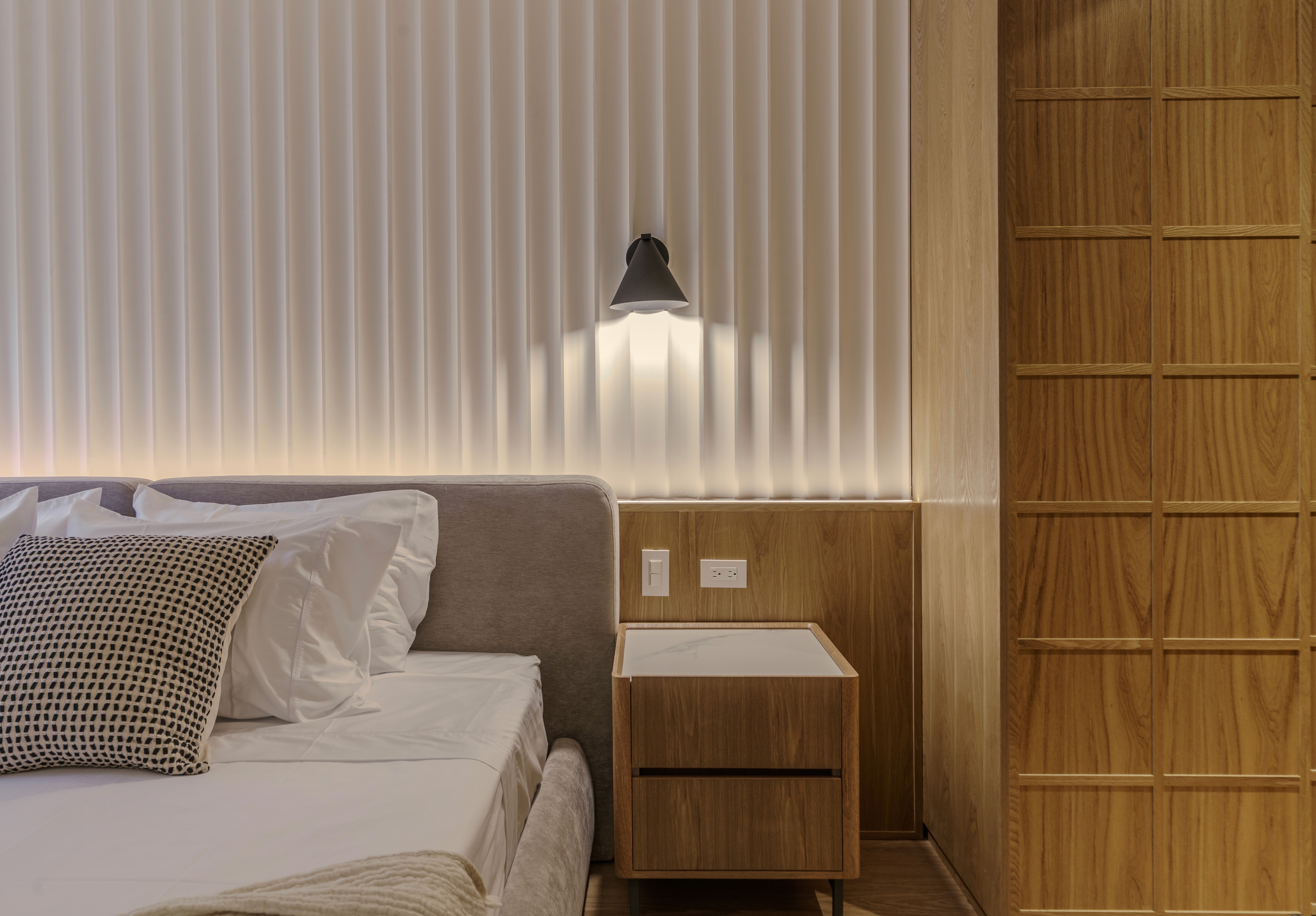 Double-height interior with flowing sculptural forms and warm raking light