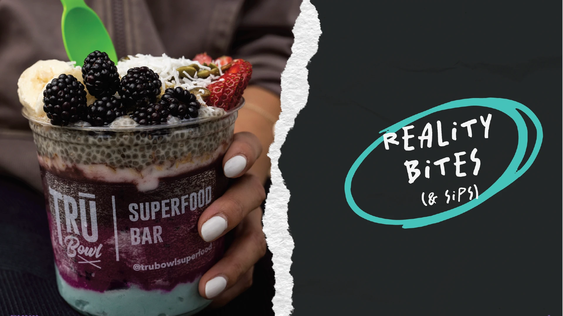 A hand holding a superfood bowl, with a ripped paper graphic element and the words 'reality bites. And sips'