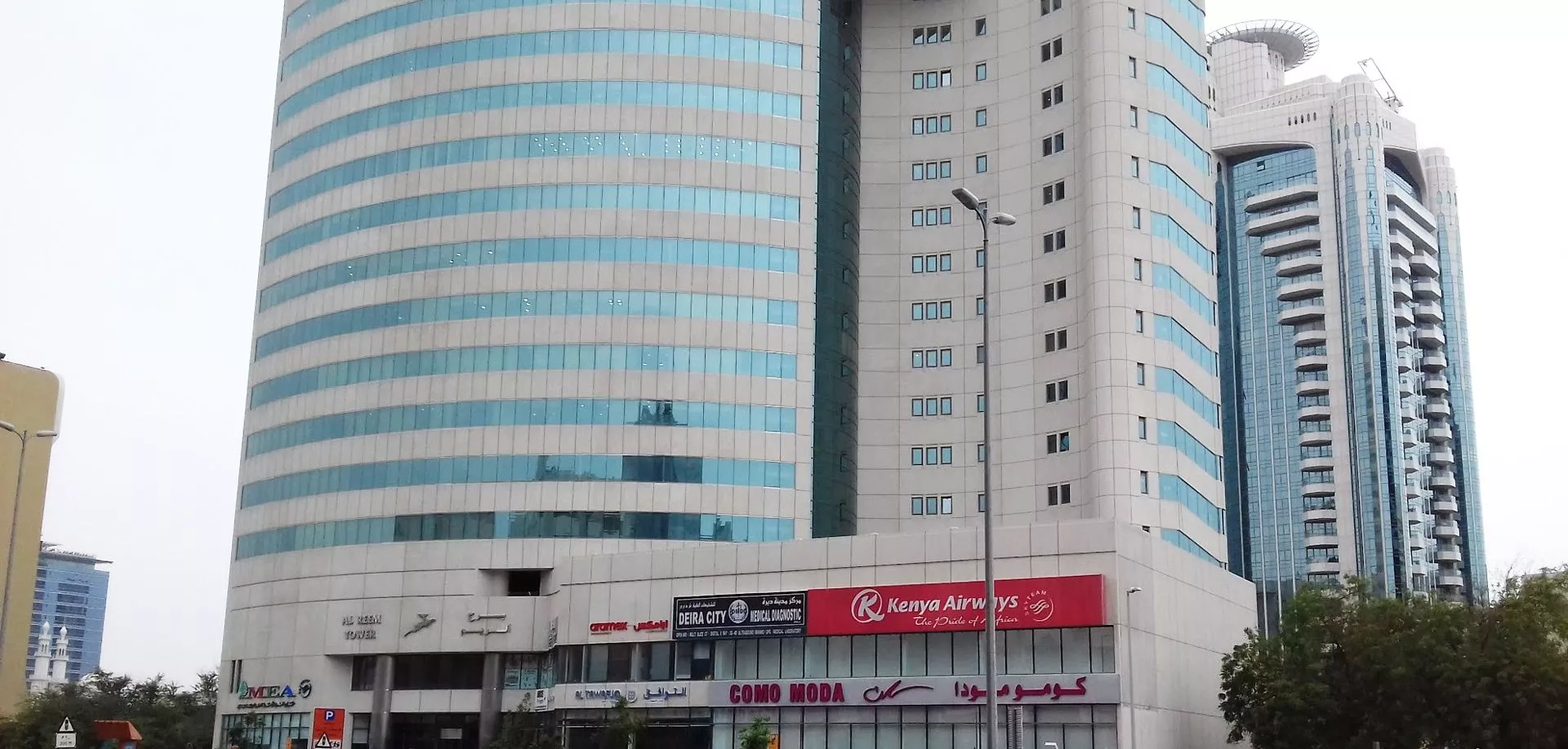 Close-up of Al Reem Tower entrance and commercial signage, perfect for businesses seeking a high-profile address.