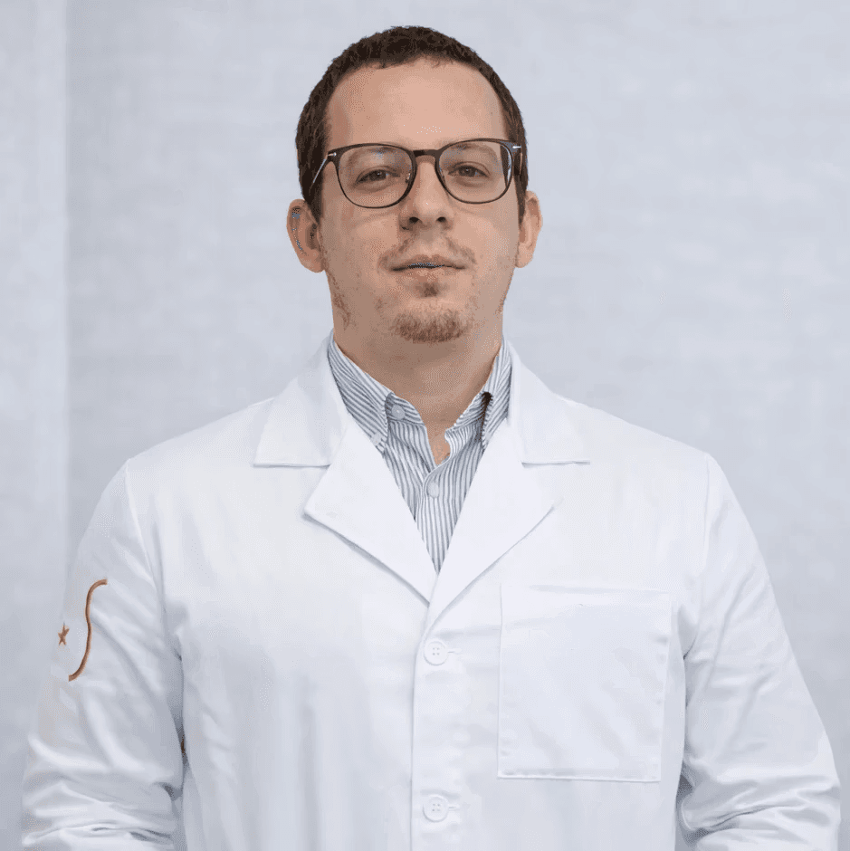 man in white dress shirt wearing black framed eyeglasses