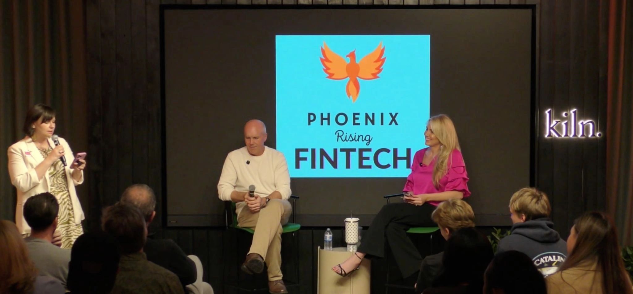 a black and white living room with a large tv