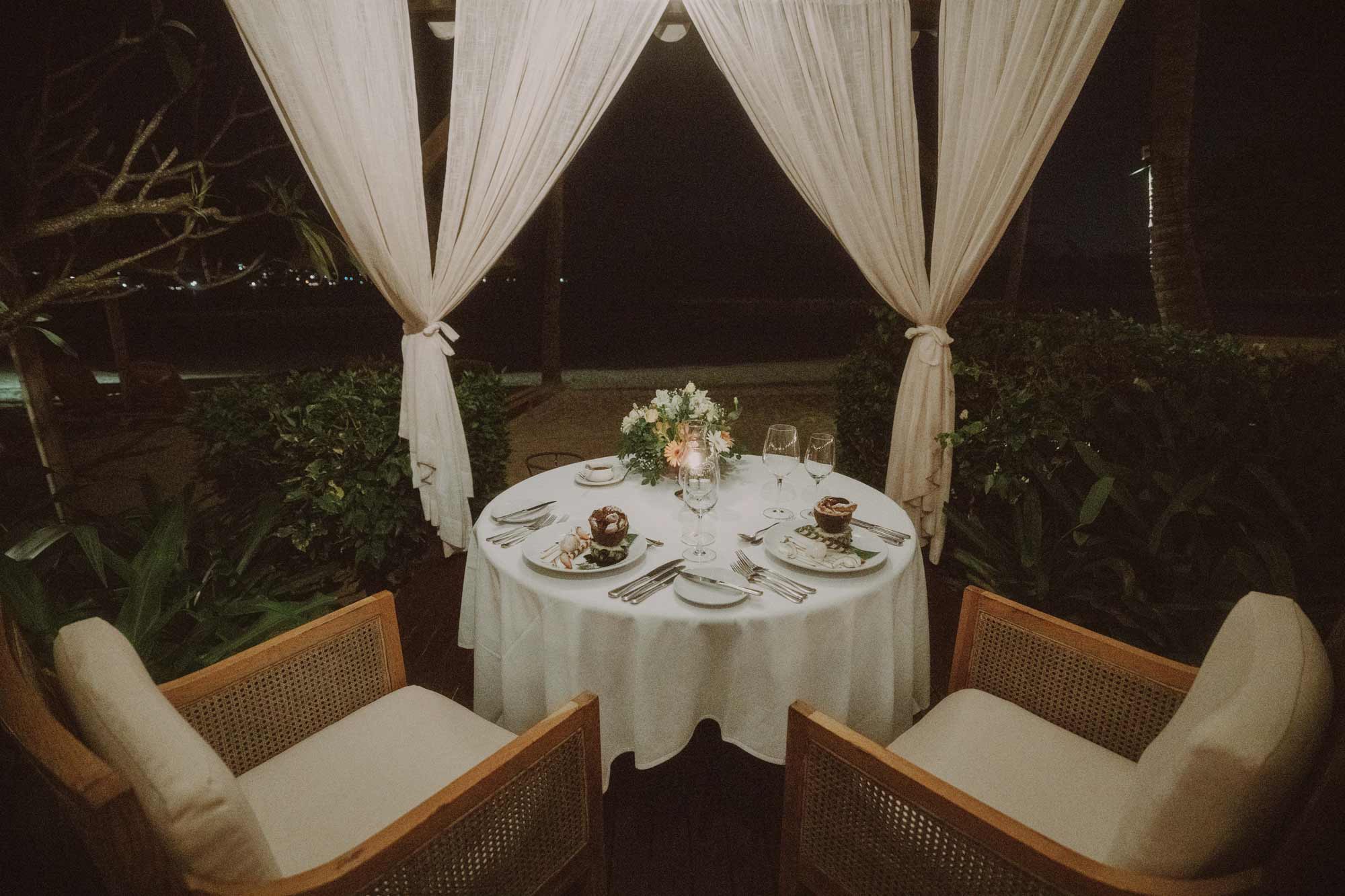 Romantic outdoor dining setup filmproduction ad for a hotel in mauritius