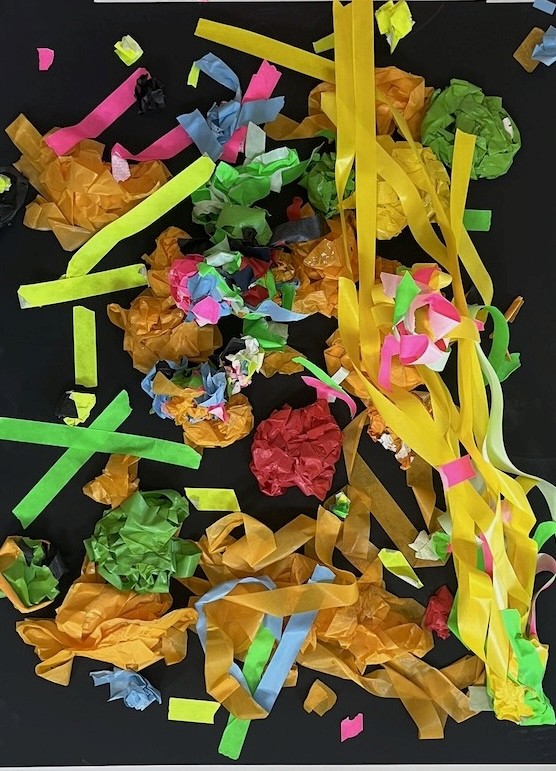 Close-up of a tree stump showing growth rings and a textured brown wood surface.