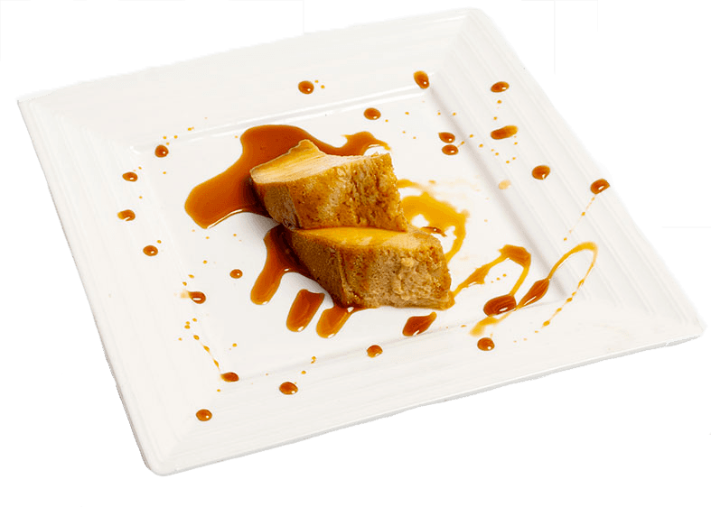 Pudim Abade de Priscos, un dessert portugais traditionnel servi au Restaurant Miragem à Pétange, Luxembourg, nappé de caramel onctueux pour une touche gourmande.