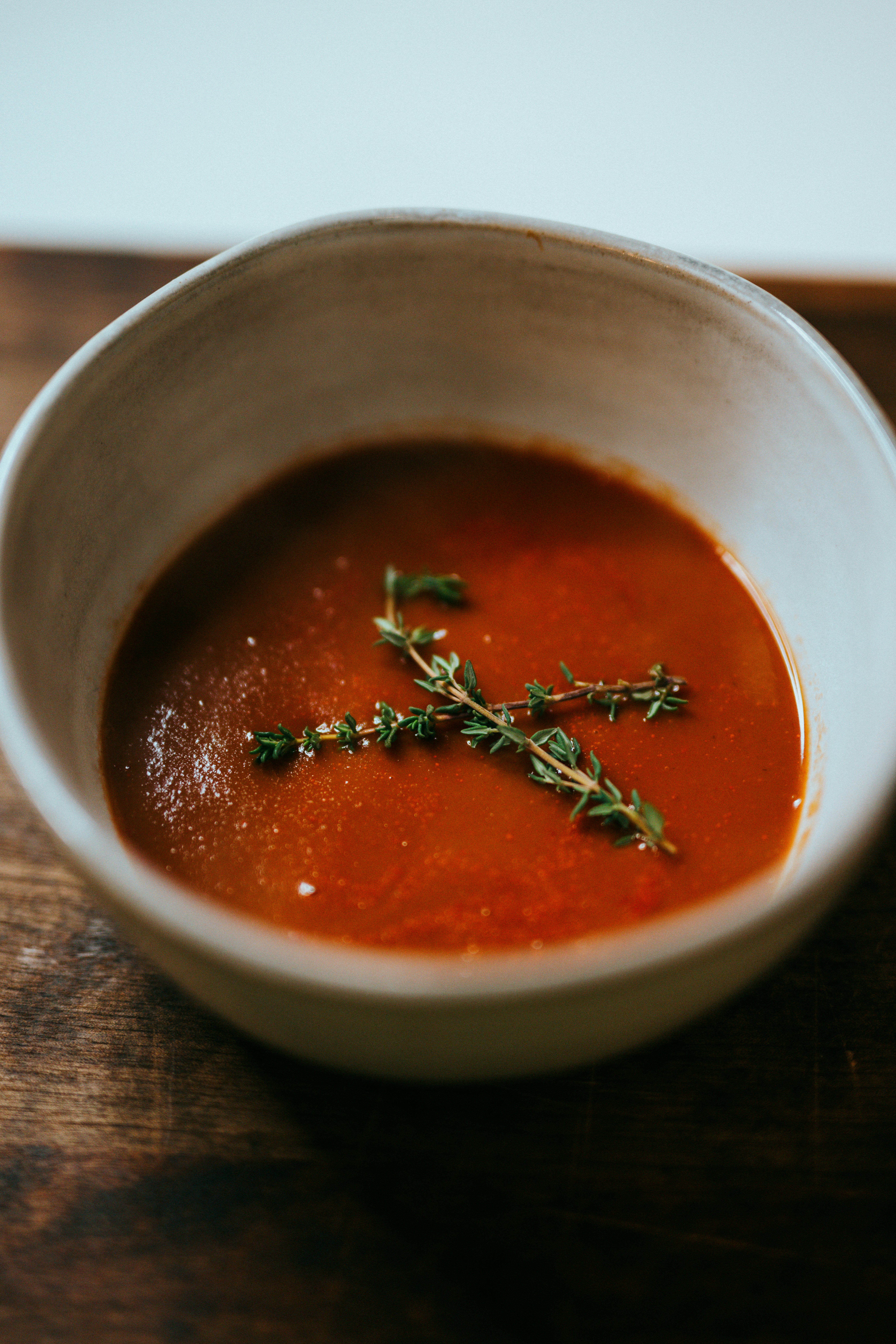 red soup in stainless steel bowl