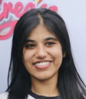 man in gray crew neck t-shirt and gray shorts sitting on basketball court